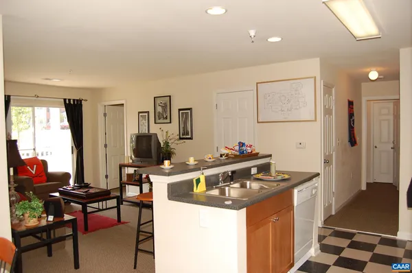 a kitchen with a stove a sink and a refrigerator