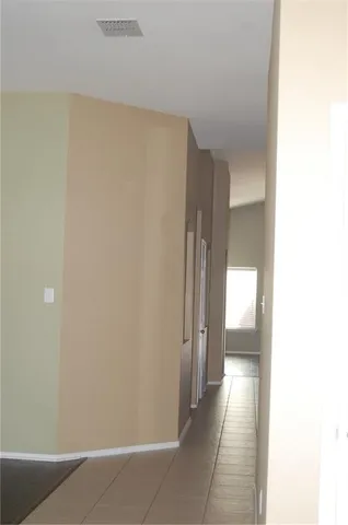 a view of a room with a hallway