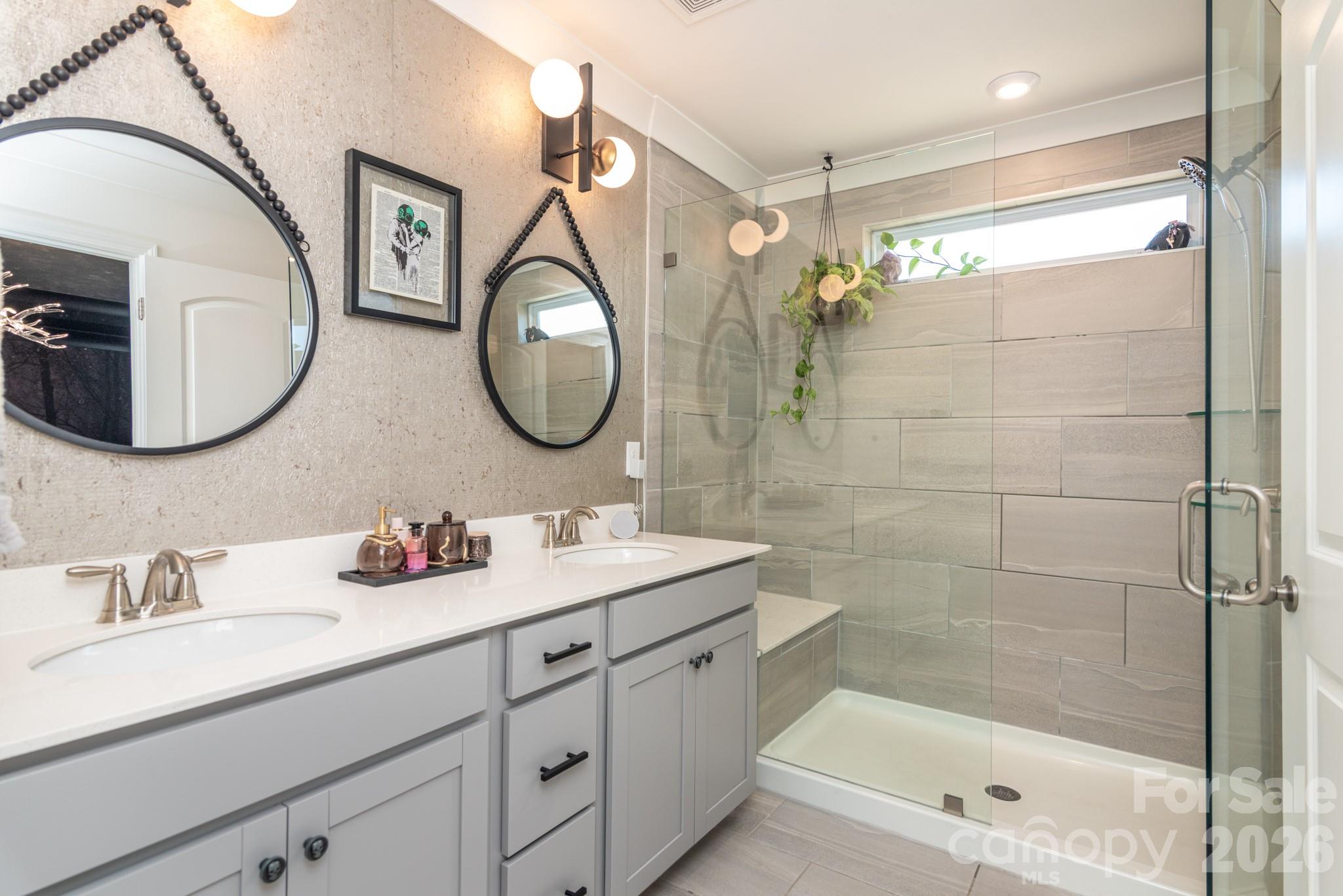 16629 Summers Walk Boulevard Davidson, NC 28036 - Photo 13 of 29 a bathroom with a double vanity sink mirror and shower