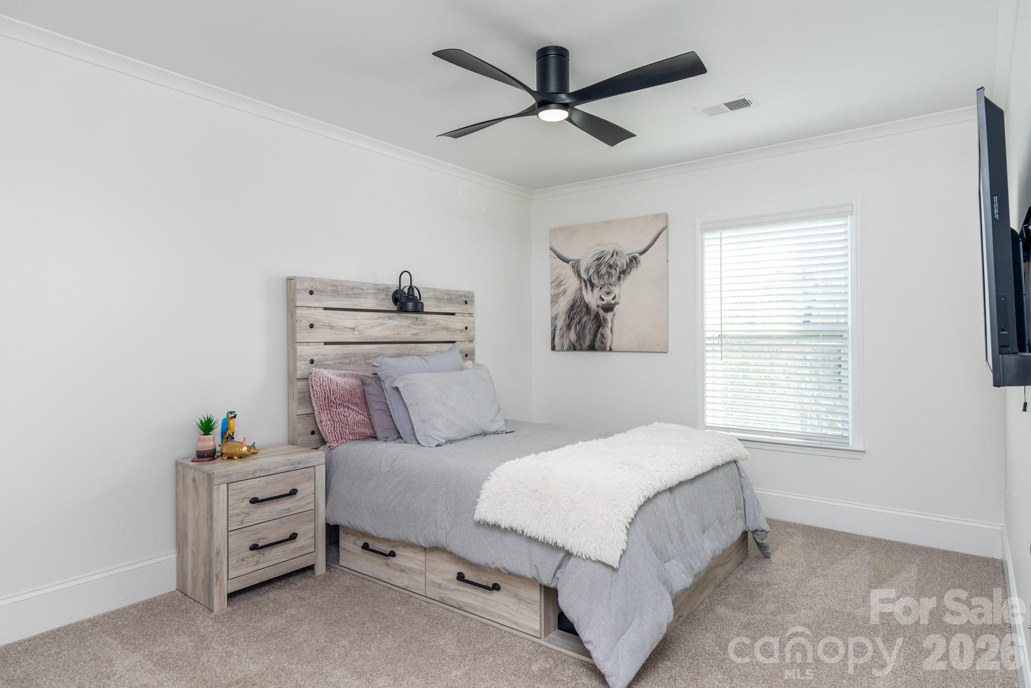 16629 Summers Walk Boulevard Davidson, NC 28036 - Photo 17 of 29 a bedroom with a bed and a window