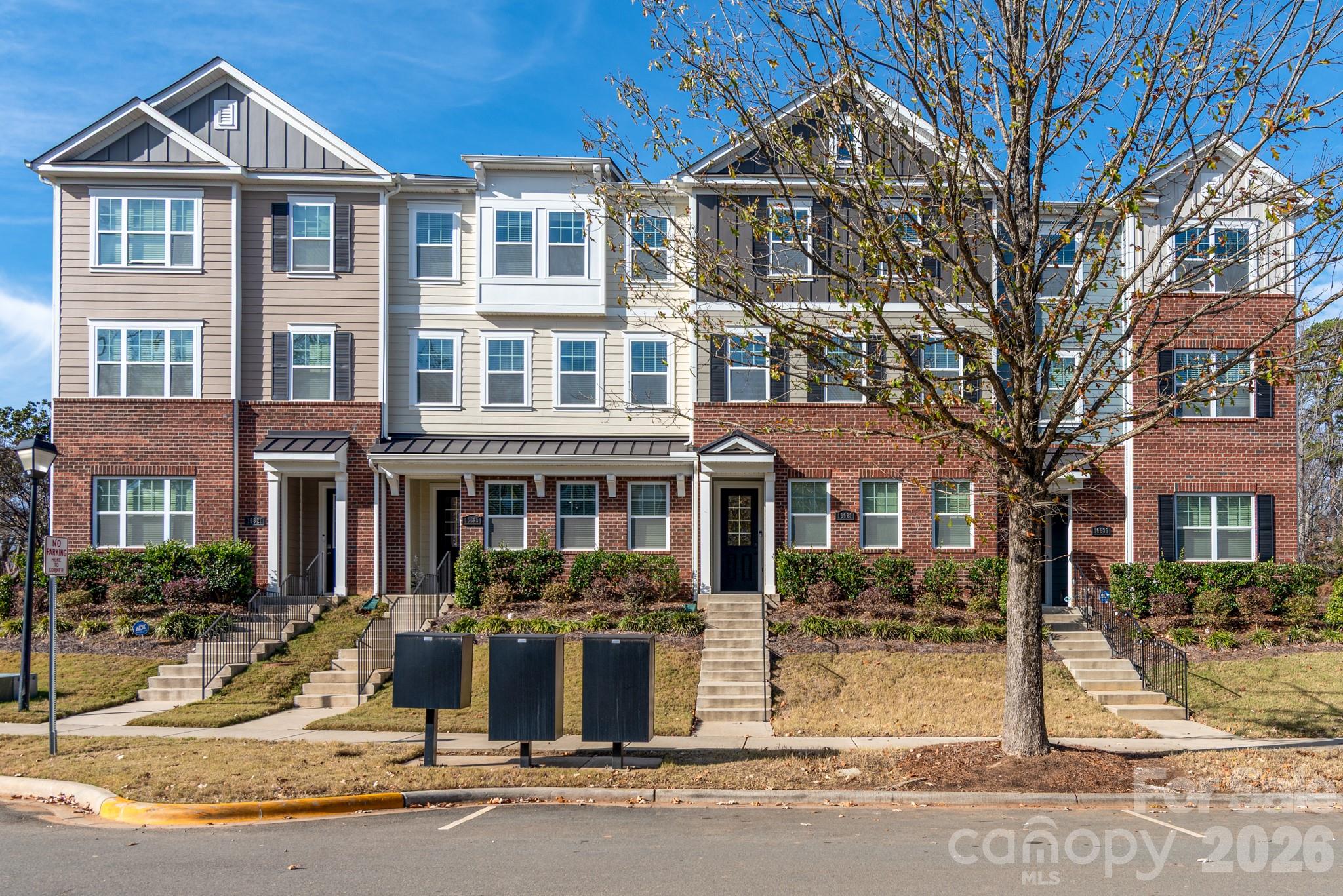 16629 Summers Walk Boulevard Davidson, NC 28036 - Photo 24 of 29 a front view of a building with a yard