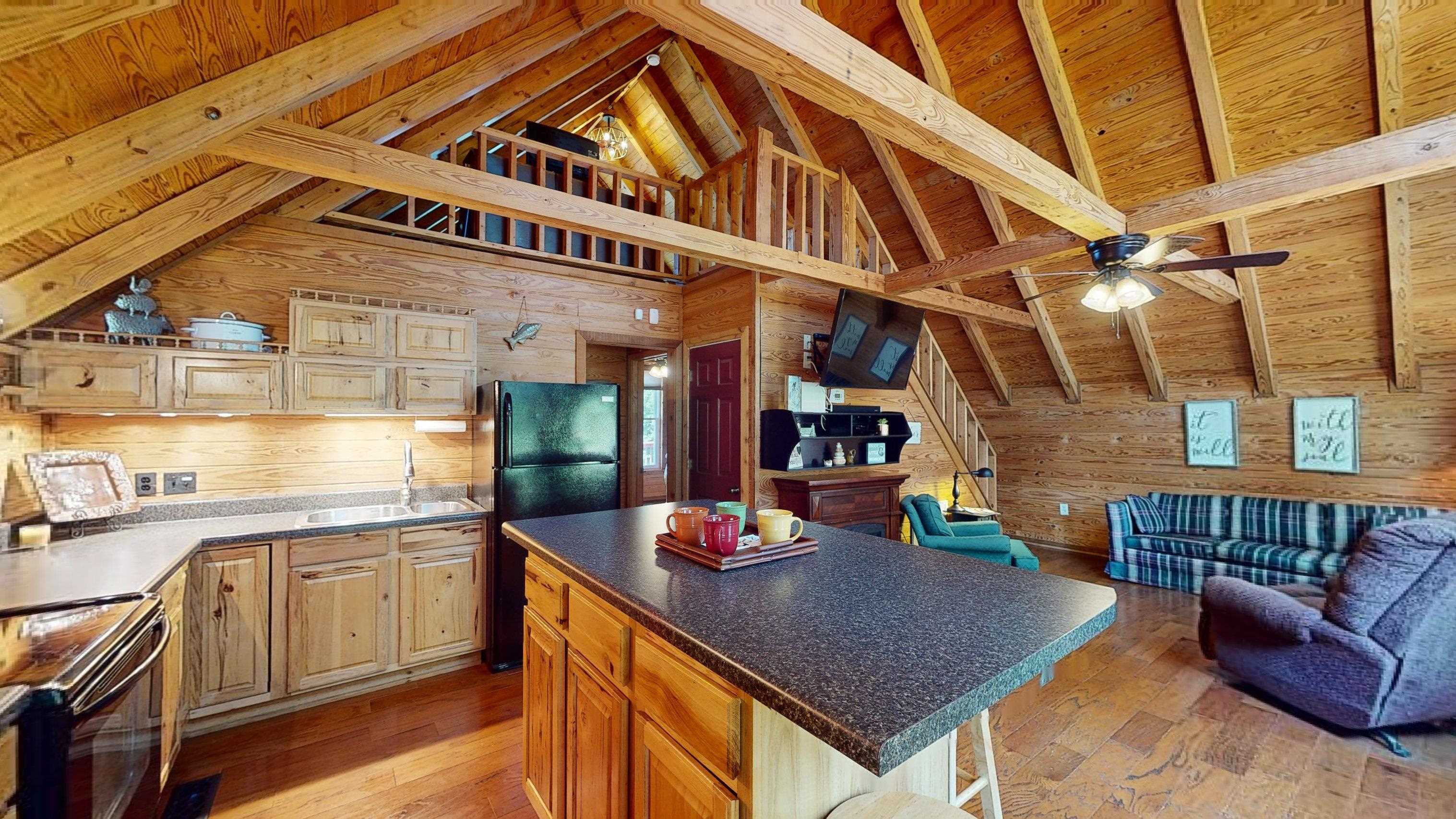 280 Slide Drive Counce, TN 38326 - Photo 5 of 26 a kitchen with stainless steel appliances granite countertop a sink a stove and cabinets