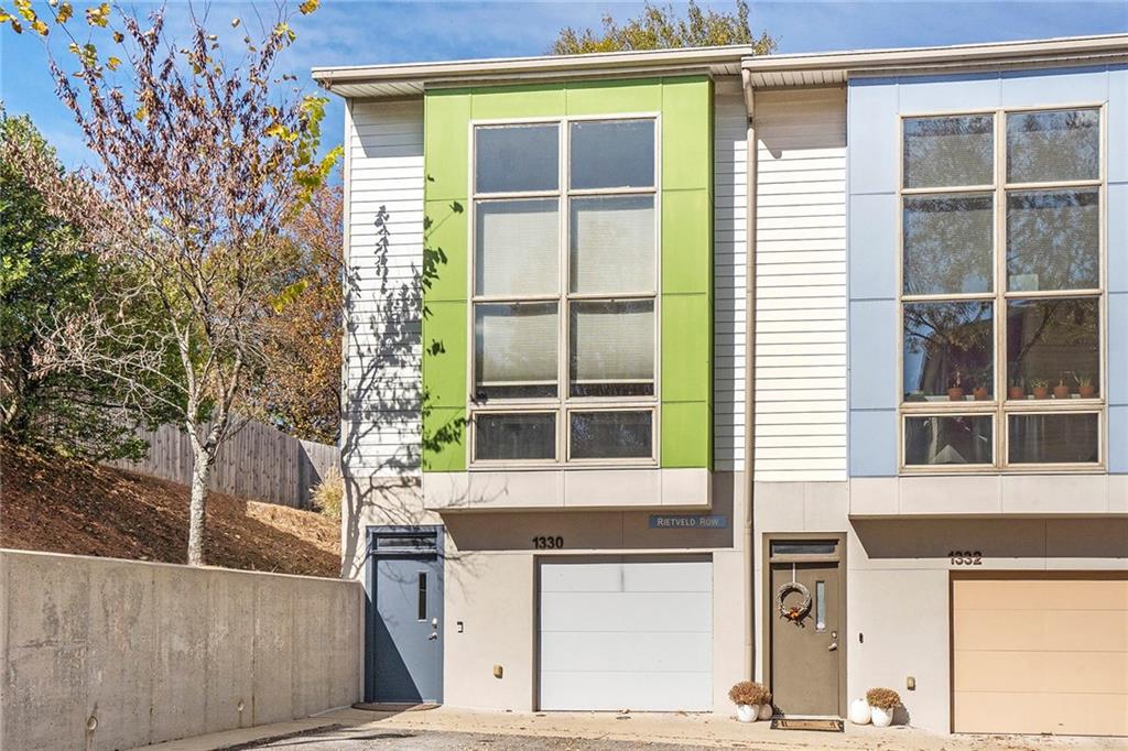 1330 Rietveld Row Northwest Atlanta, GA 30318 - Photo 1 of 1 View of front of house featuring a garage