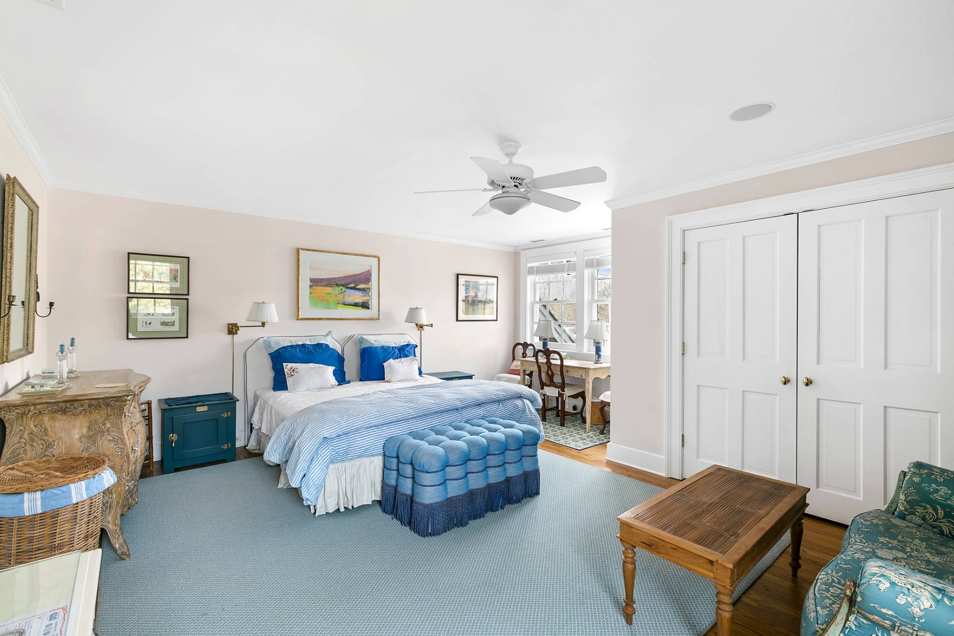 97 Briar Patch Road East Hampton, NY 11937 - Photo 7 of 12 a bedroom with a bed and a chandelier