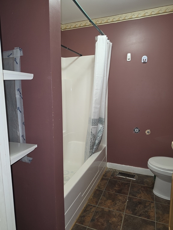 44-th 19th Street, Unit REAR Lowell, MA 01850 - Photo 12 of 13 a bathroom with a granite countertop sink and a toilet