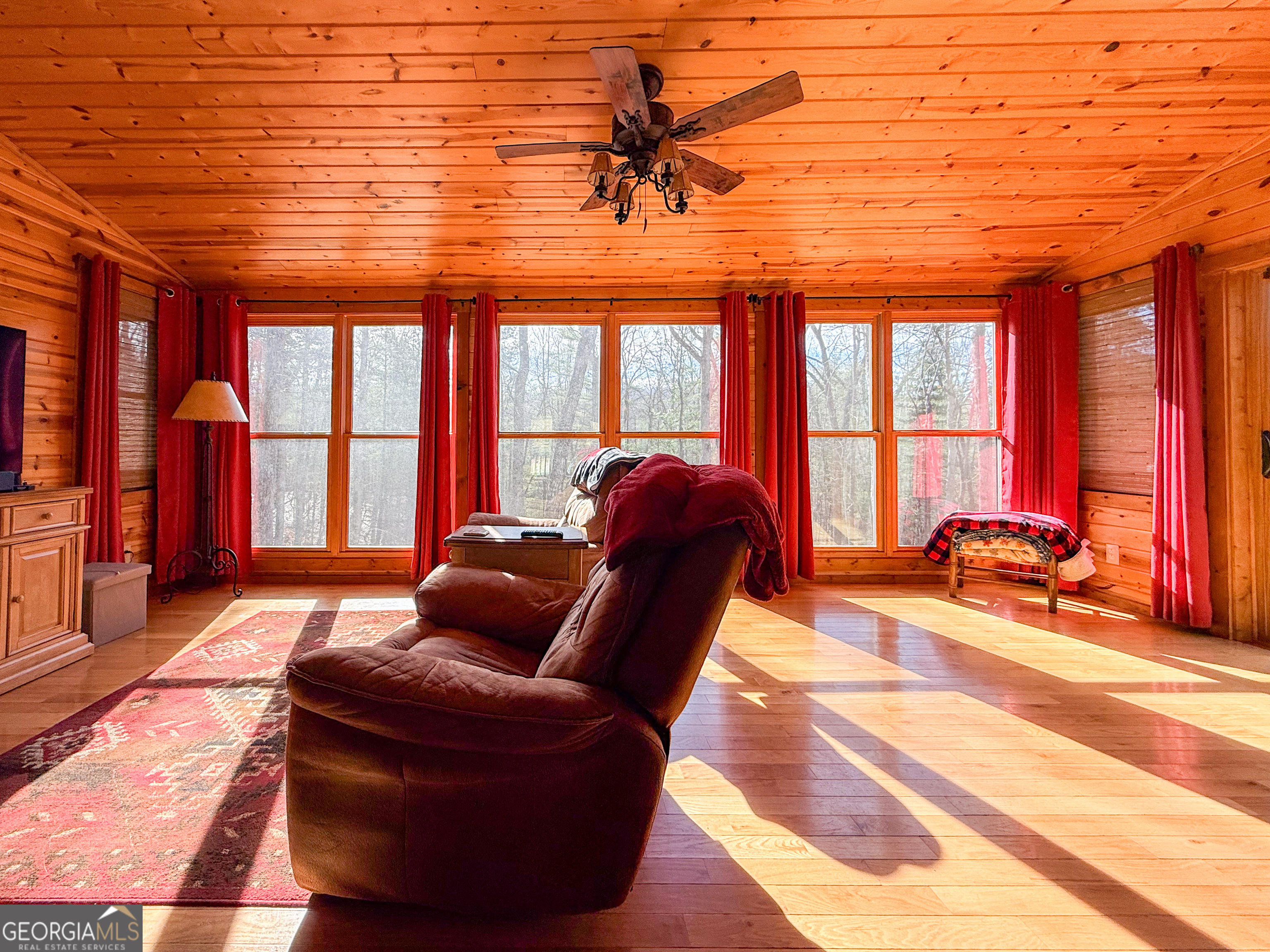 202 Shepherds Ridge Morganton, GA 30560 - Photo 15 of 74 a living room with furniture fireplace and floor to ceiling windows