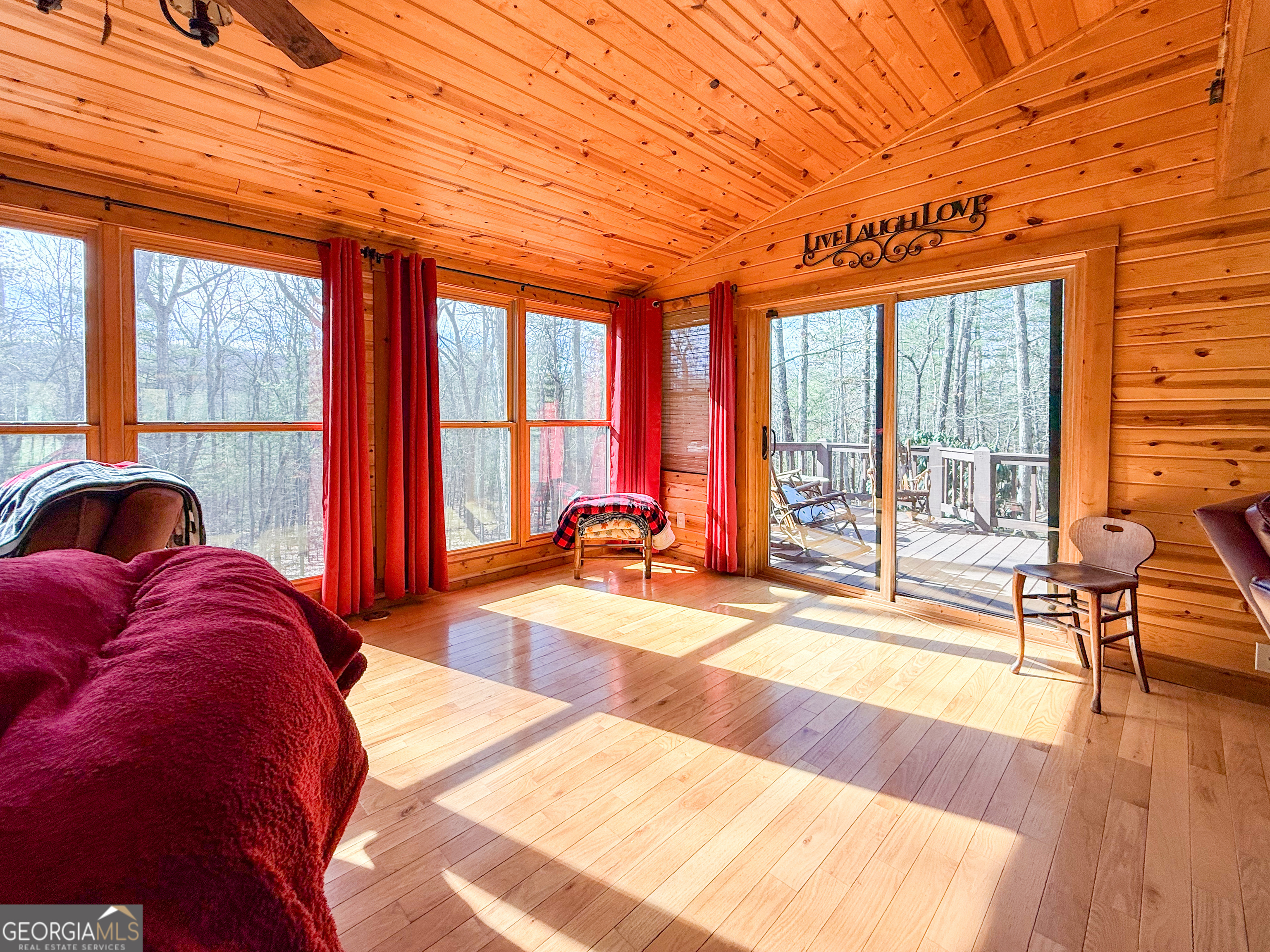 202 Shepherds Ridge Morganton, GA 30560 - Photo 17 of 74 a view of a livingroom with furniture and floor to ceiling windows
