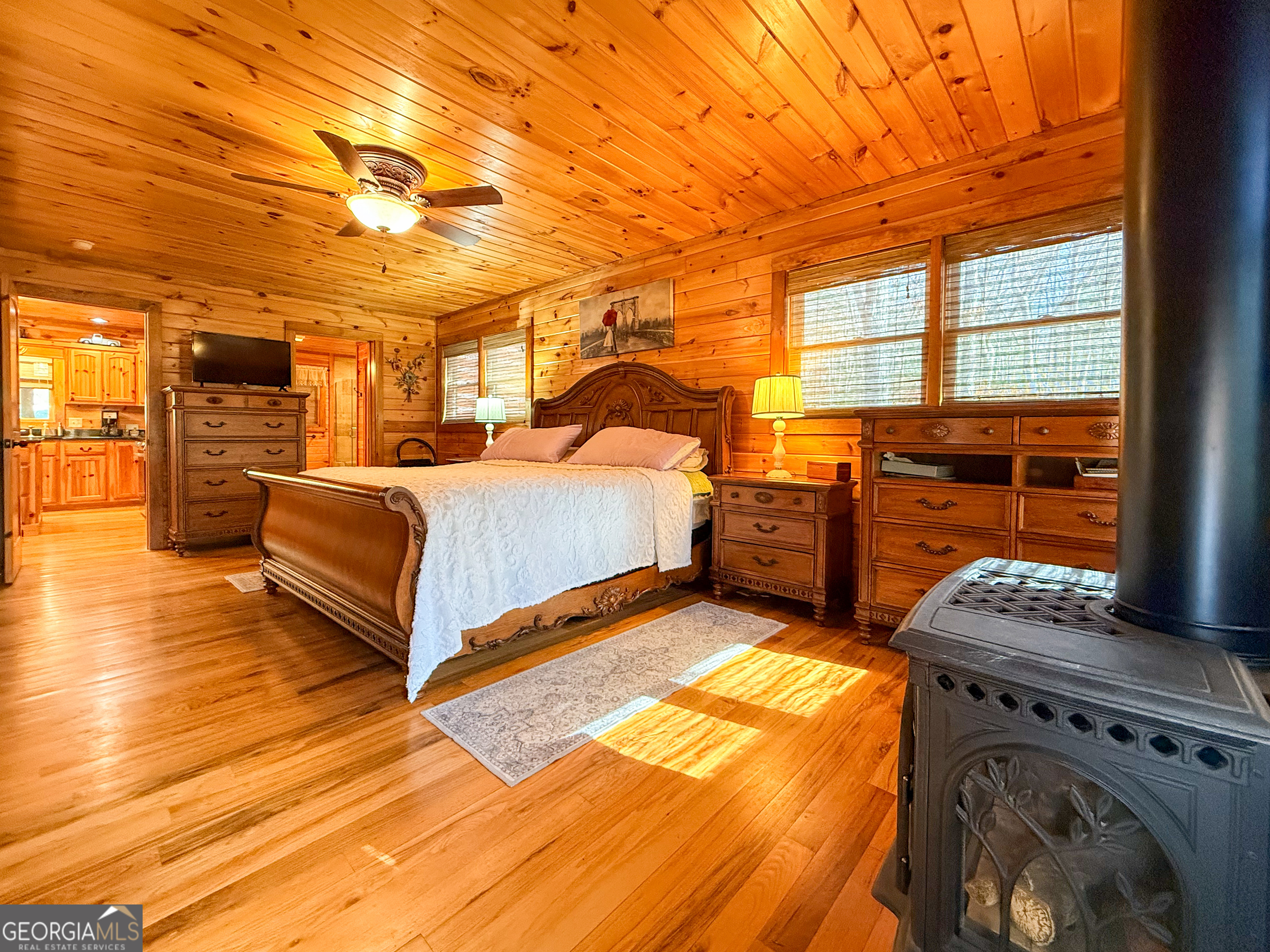 202 Shepherds Ridge Morganton, GA 30560 - Photo 19 of 74 a bedroom with a bed and a night stand