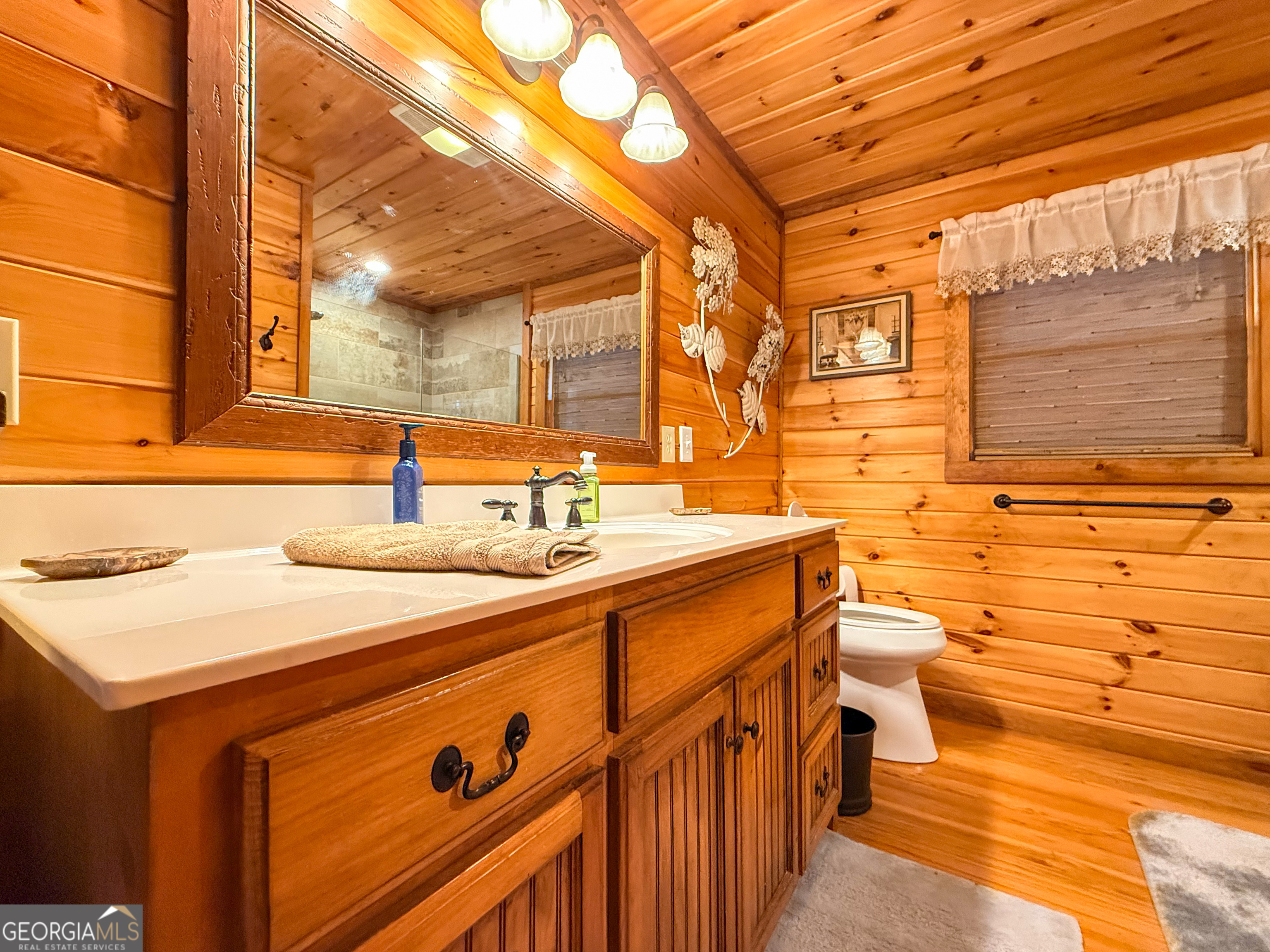 202 Shepherds Ridge Morganton, GA 30560 - Photo 23 of 74 a bathroom with a sink and a mirror