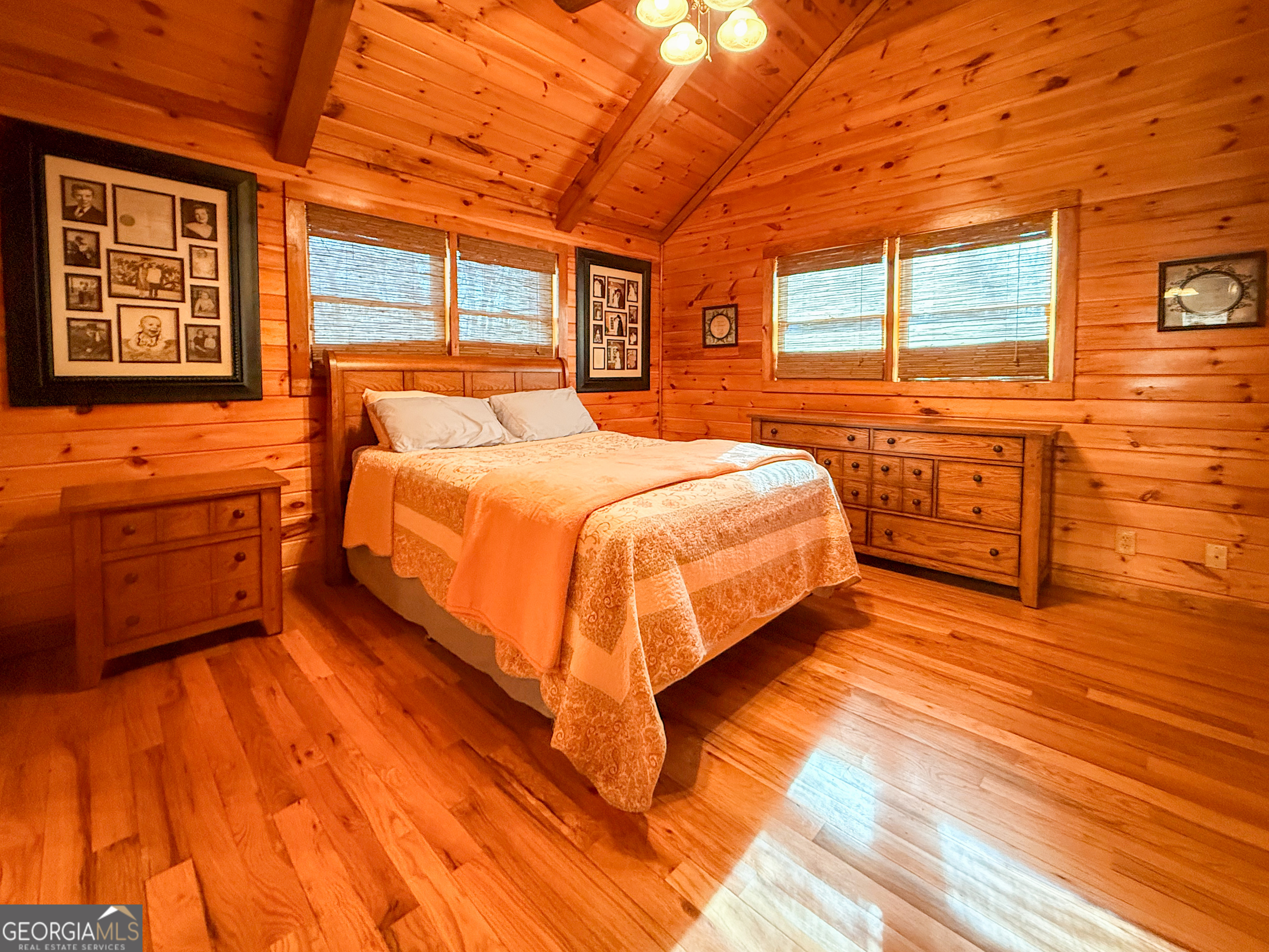 202 Shepherds Ridge Morganton, GA 30560 - Photo 30 of 74 a bed sitting in a bedroom next to a window