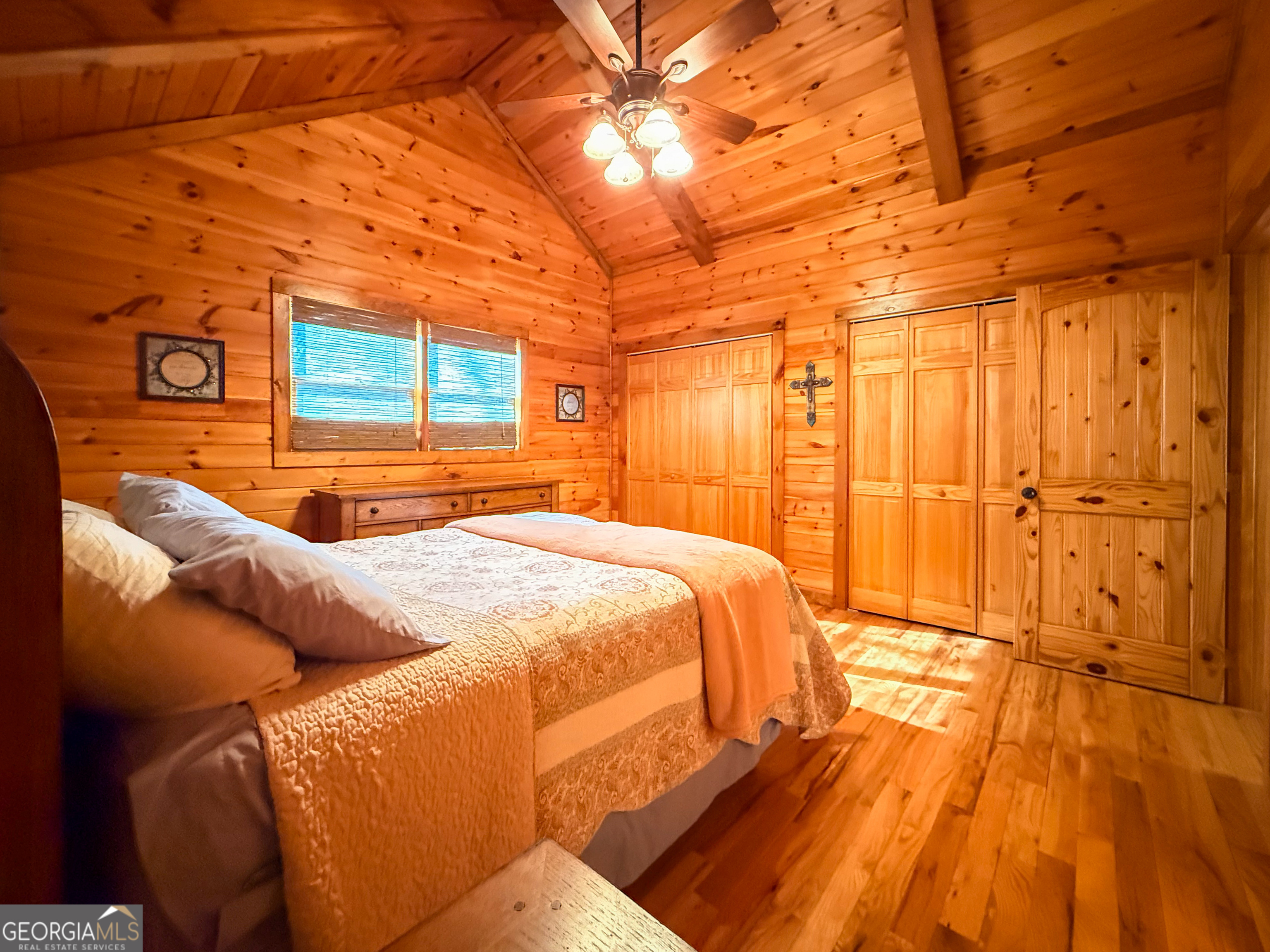 202 Shepherds Ridge Morganton, GA 30560 - Photo 32 of 74 a bed sitting in a bedroom next to a yard