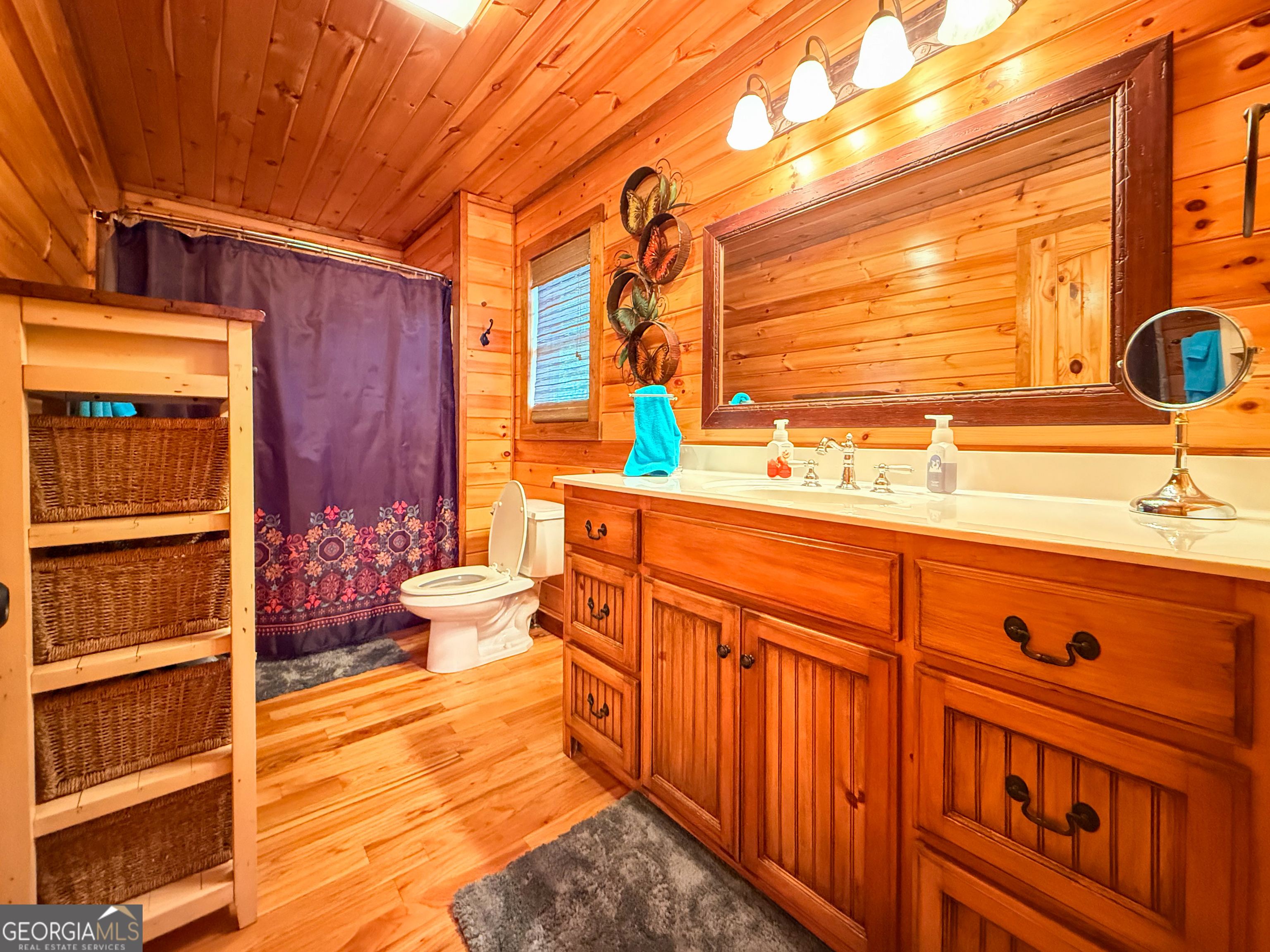 202 Shepherds Ridge Morganton, GA 30560 - Photo 33 of 74 a bathroom with a sink a toilet and shower