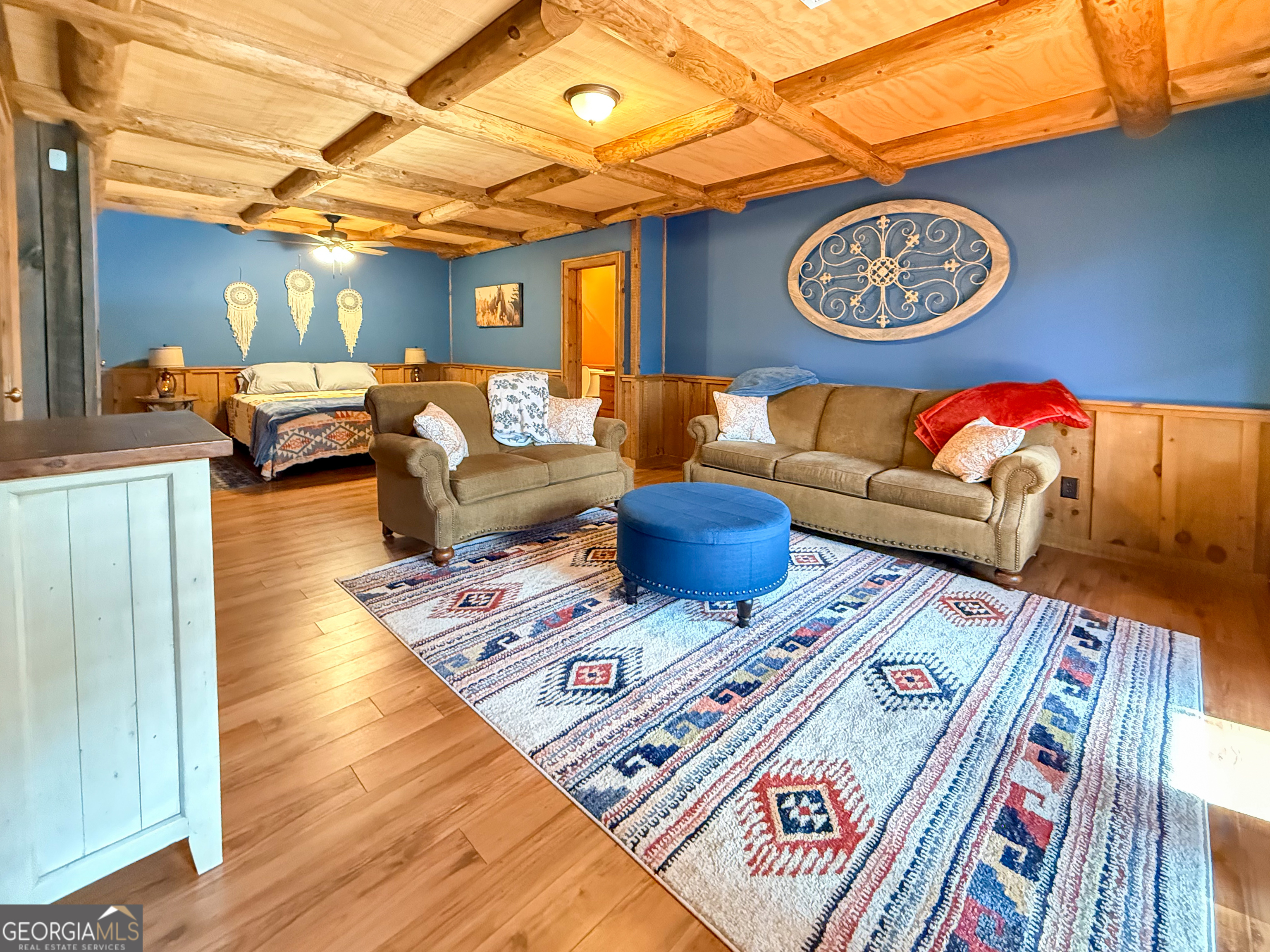202 Shepherds Ridge Morganton, GA 30560 - Photo 38 of 74 a view of a couch in wooden floor