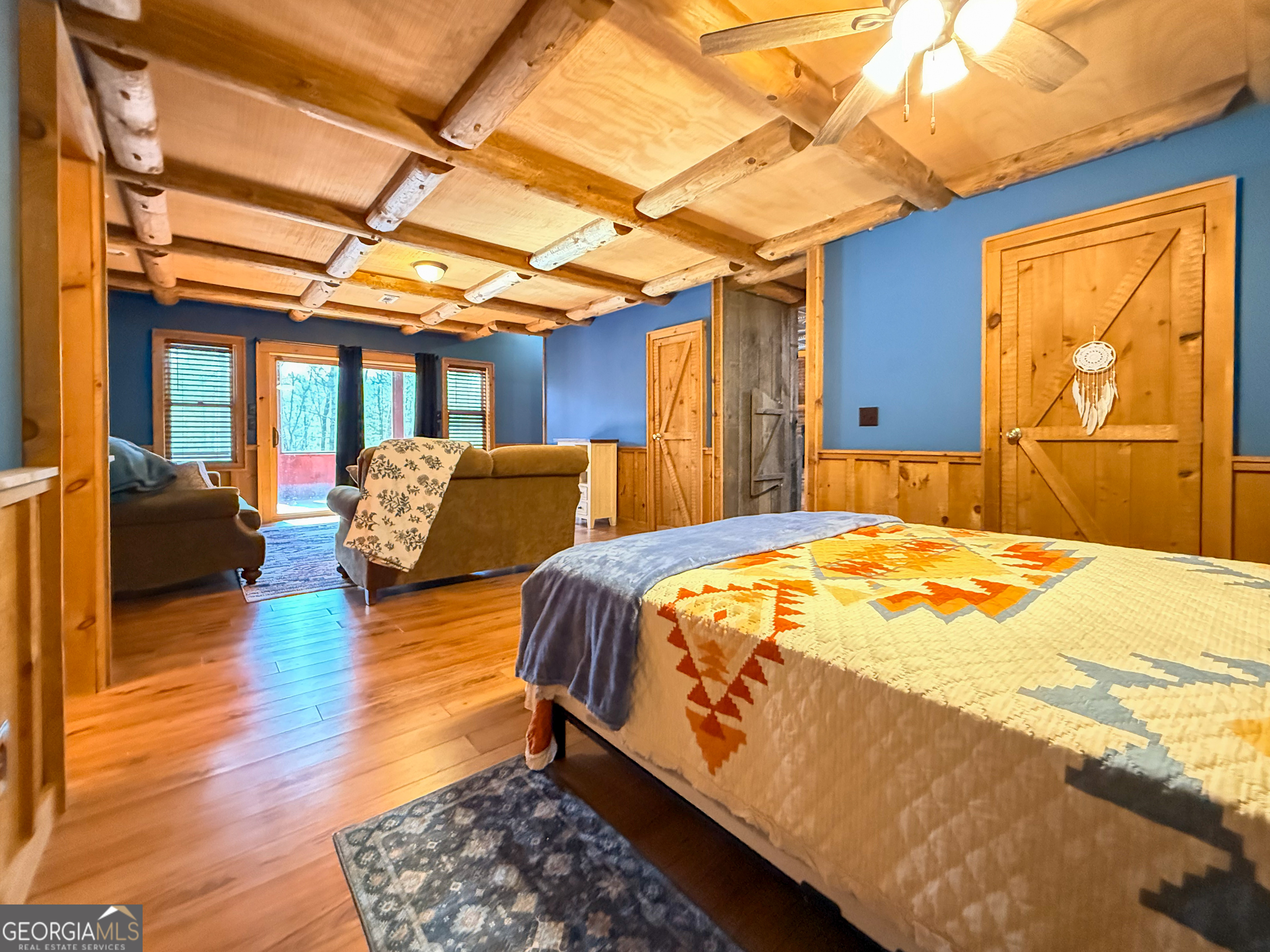 202 Shepherds Ridge Morganton, GA 30560 - Photo 41 of 74 a spacious bedroom with a bed and wooden floor