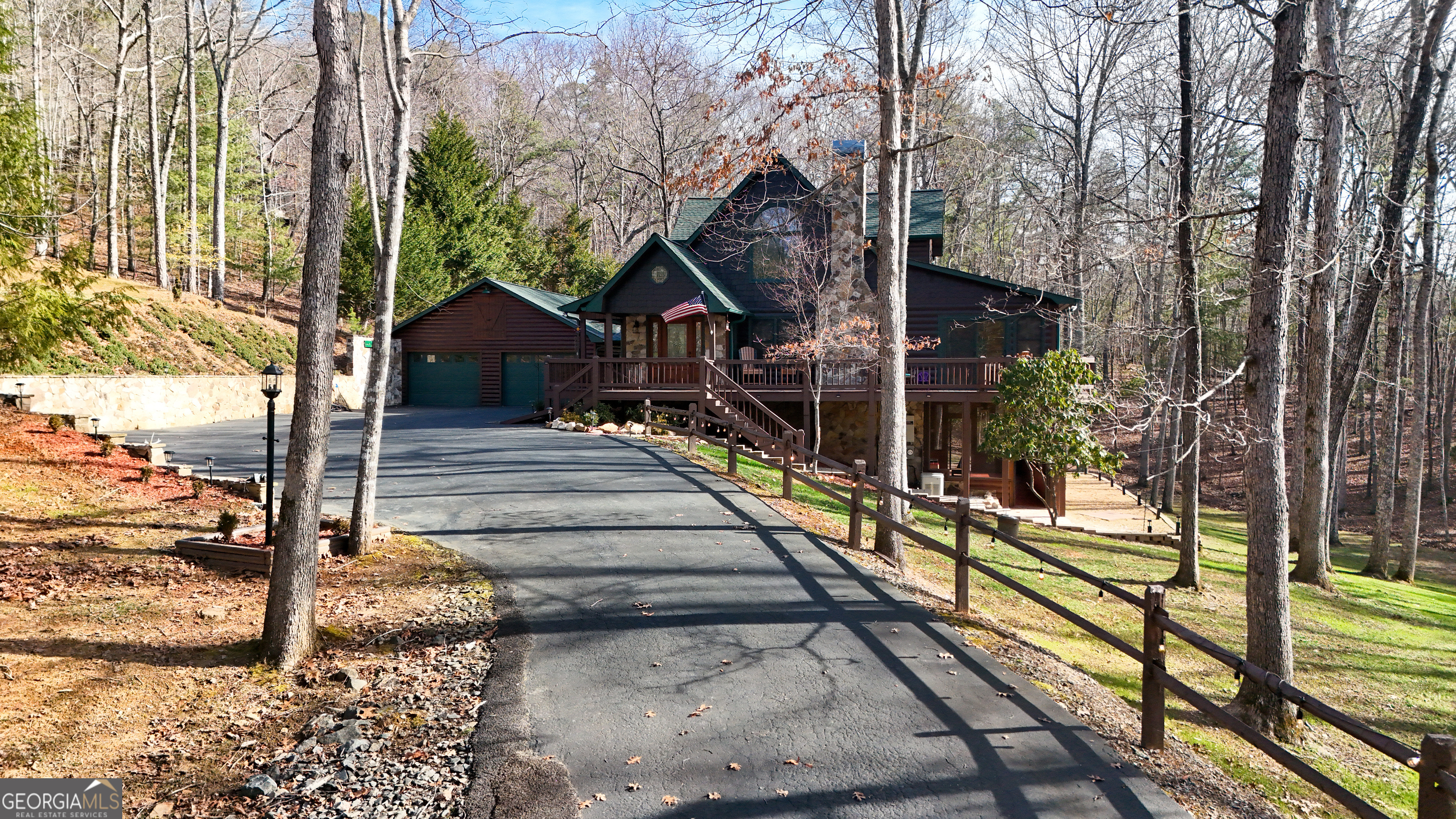 202 Shepherds Ridge Morganton, GA 30560 - Photo 67 of 74 a view of a house with wooden fence next to a road