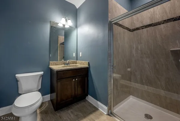 a bathroom with a toilet sink and shower