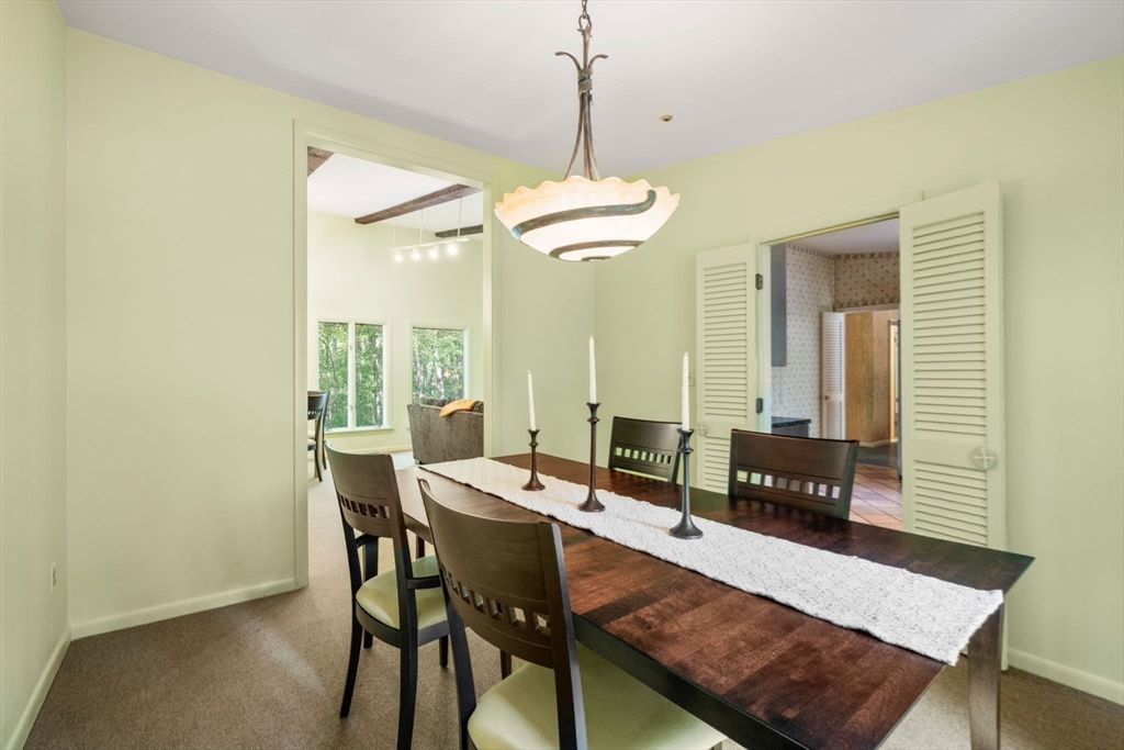 23 Indian Ridge Road Natick, MA 01760 - Photo 12 of 40 a view of a dining room with furniture and window