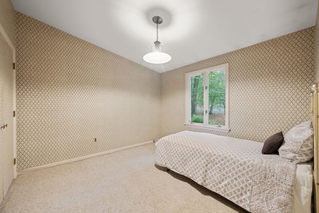 23 Indian Ridge Road Natick, MA 01760 - Photo 19 of 40 a bedroom with a bed and a window