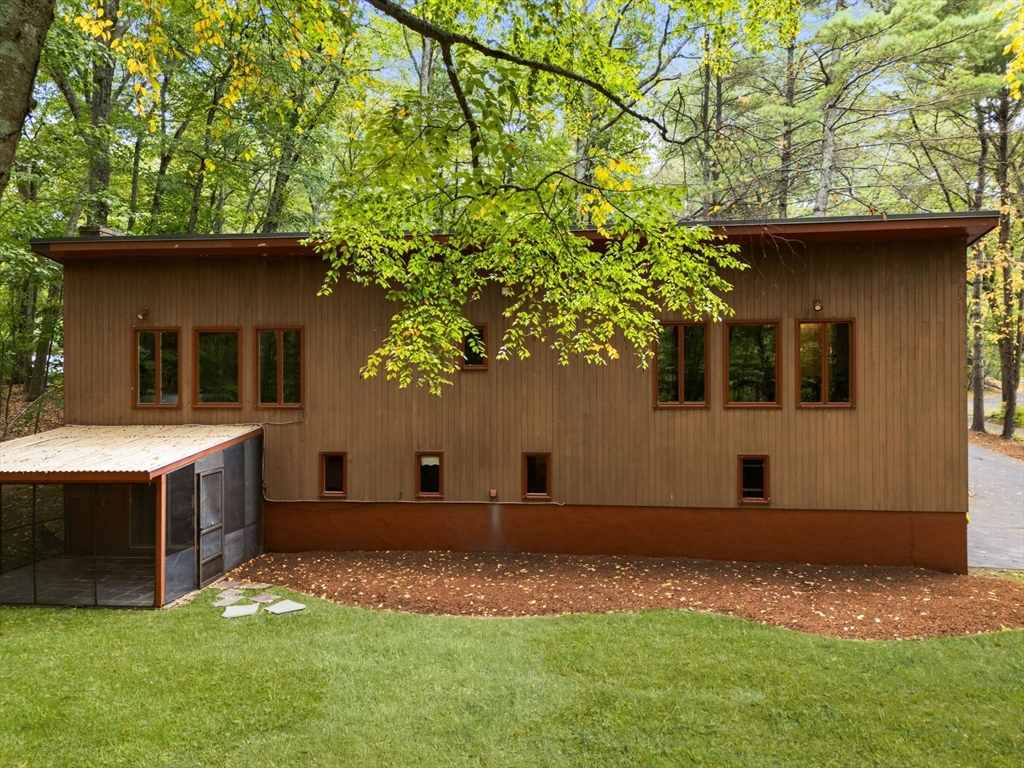 23 Indian Ridge Road Natick, MA 01760 - Photo 25 of 40 a front view of a house with a yard