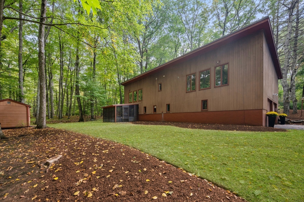 23 Indian Ridge Road Natick, MA 01760 - Photo 26 of 40 a house view with a backyard space