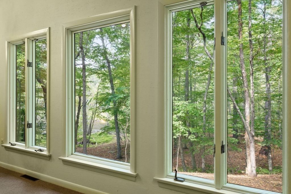 23 Indian Ridge Road Natick, MA 01760 - Photo 4 of 40 a view of a room that has a balcony