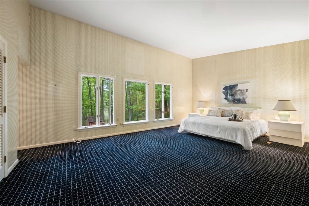 23 Indian Ridge Road Natick, MA 01760 - Photo 5 of 40 a bedroom with furniture and a large window