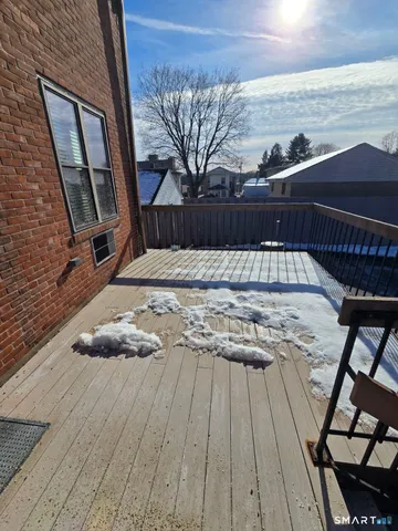 a view of a balcony with wooden floor