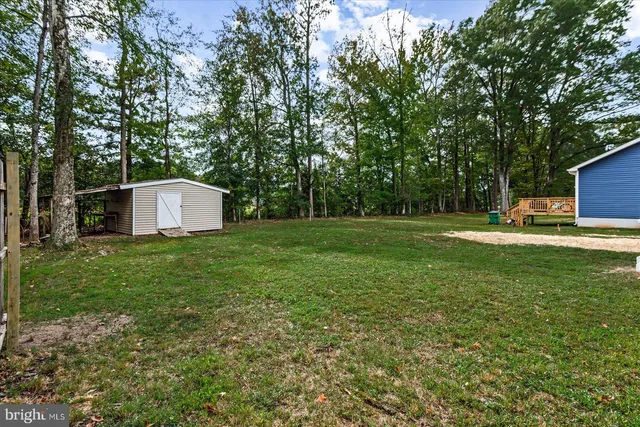 a backyard of a house with lots of green space