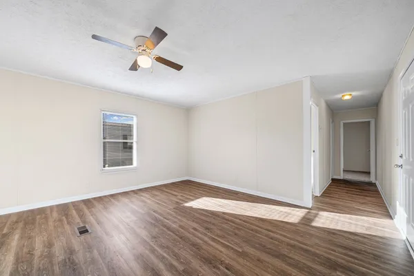 a view of kitchen with wooden floor and window