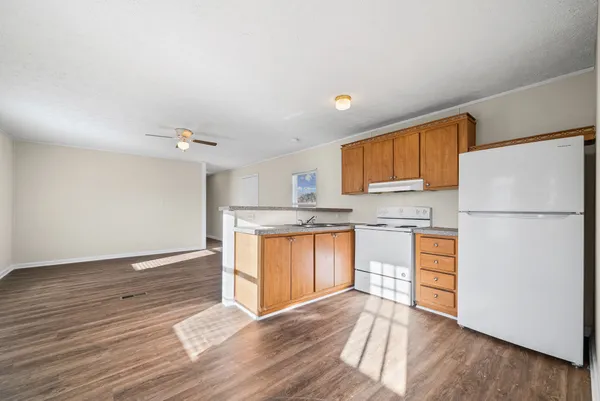 a kitchen with a sink stove and cabinets