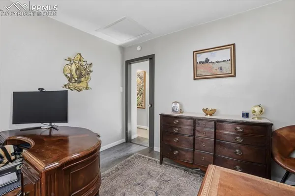 a room with a desk and chair
