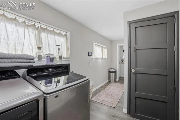 a kitchen with a sink and a refrigerator