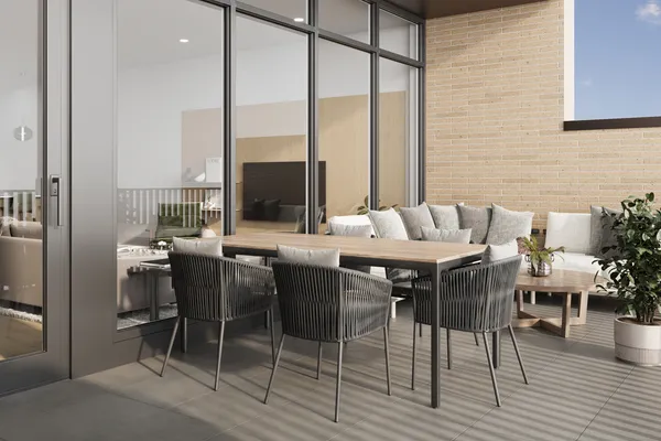 a view of an outside dining space with furniture