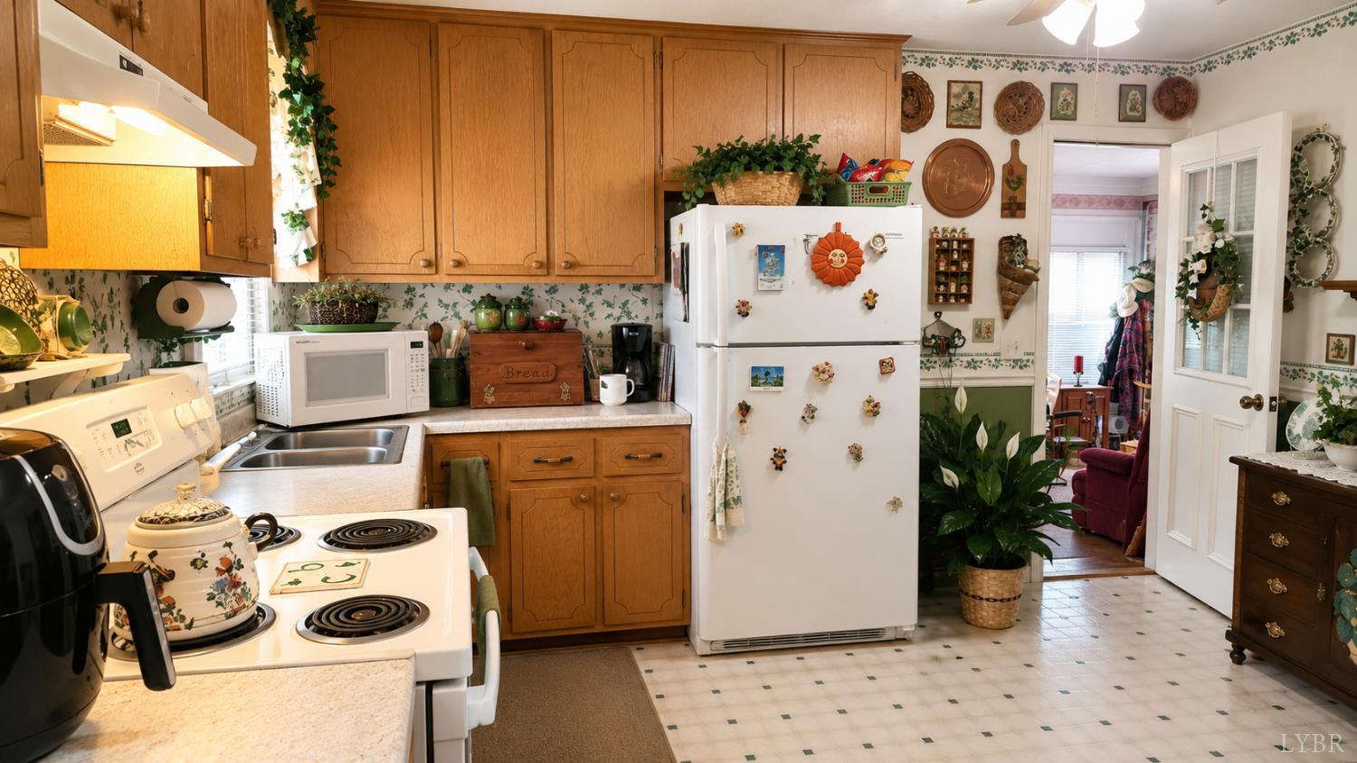 2346 Mitchell Mill Road Gladys, VA 24554 - Photo 5 of 38 a kitchen with a refrigerator and a stove