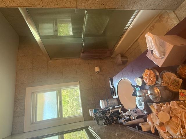 4225 Stars Road East Marion, NY 11939 - Photo 11 of 16 a bathroom with a sink toilet and shower