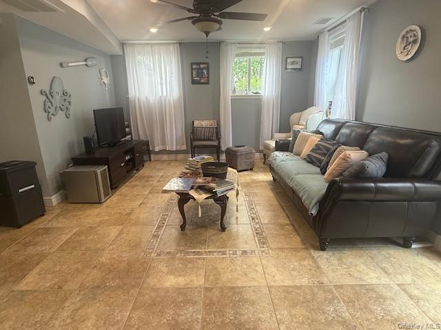 4225 Stars Road East Marion, NY 11939 - Photo 14 of 16 a living room with furniture and a flat screen tv