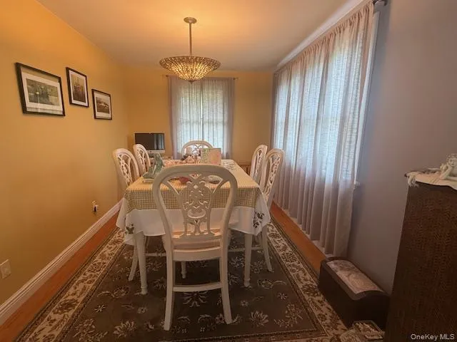 a view of a dining room with furniture and window