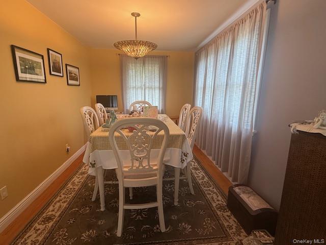 4225 Stars Road East Marion, NY 11939 - Photo 6 of 16 a view of a dining room with furniture and window