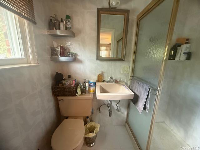 4225 Stars Road East Marion, NY 11939 - Photo 10 of 16 a bathroom with a sink a toilet and mirror