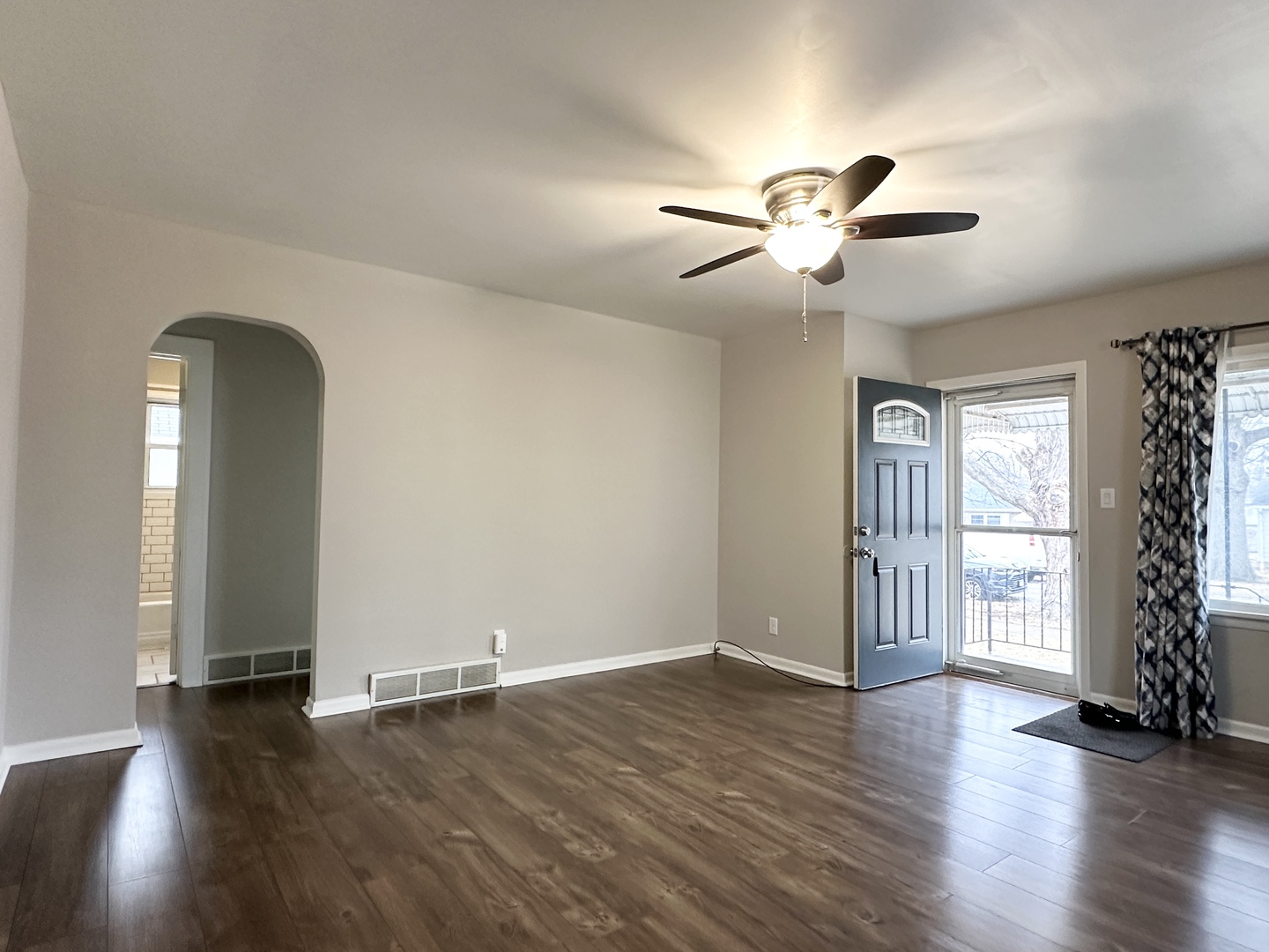 1075 South 7th Avenue Kankakee, IL 60901 - Photo 15 of 32 a view of empty room with wooden floor and fan