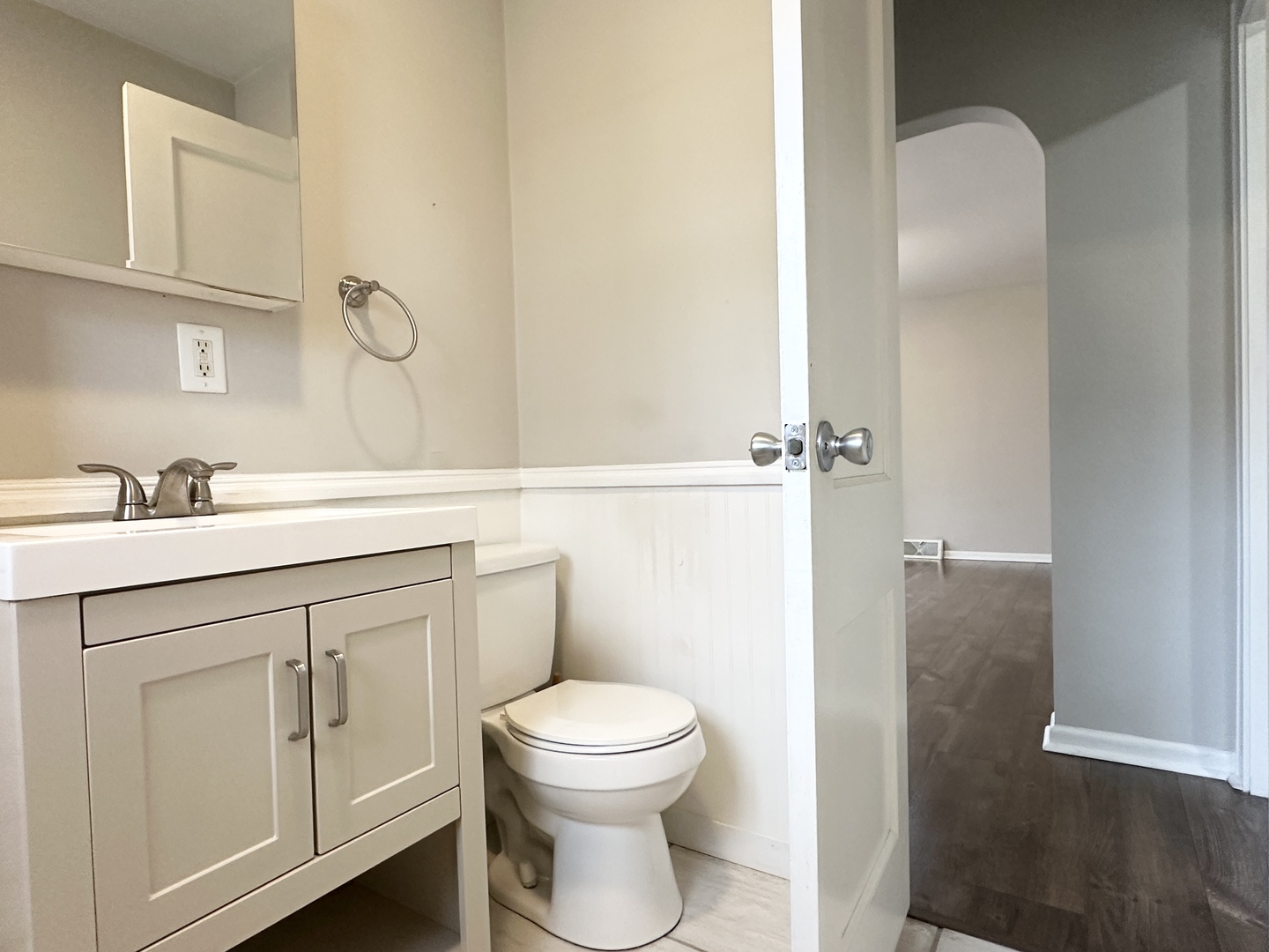 1075 South 7th Avenue Kankakee, IL 60901 - Photo 18 of 32 a bathroom with a toilet sink and mirror