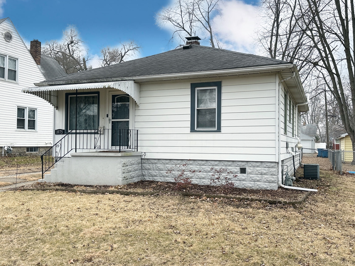 1075 South 7th Avenue Kankakee, IL 60901 - Photo 2 of 32 a view of a house with a yard