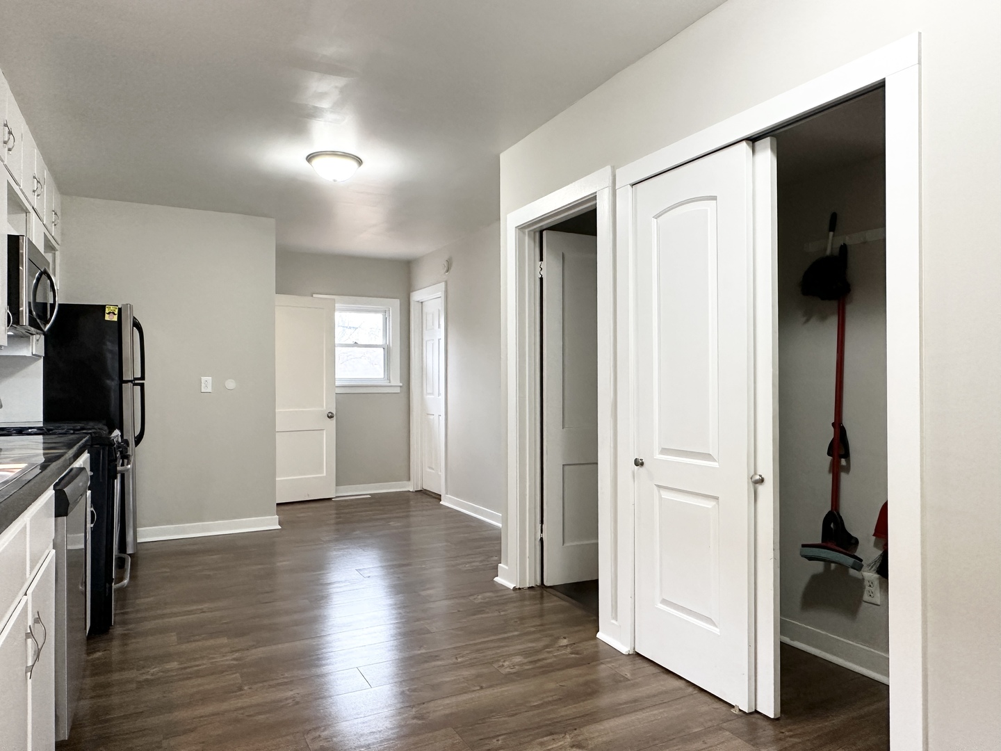 1075 South 7th Avenue Kankakee, IL 60901 - Photo 8 of 32 a view of a hallway with wooden floor and staircase