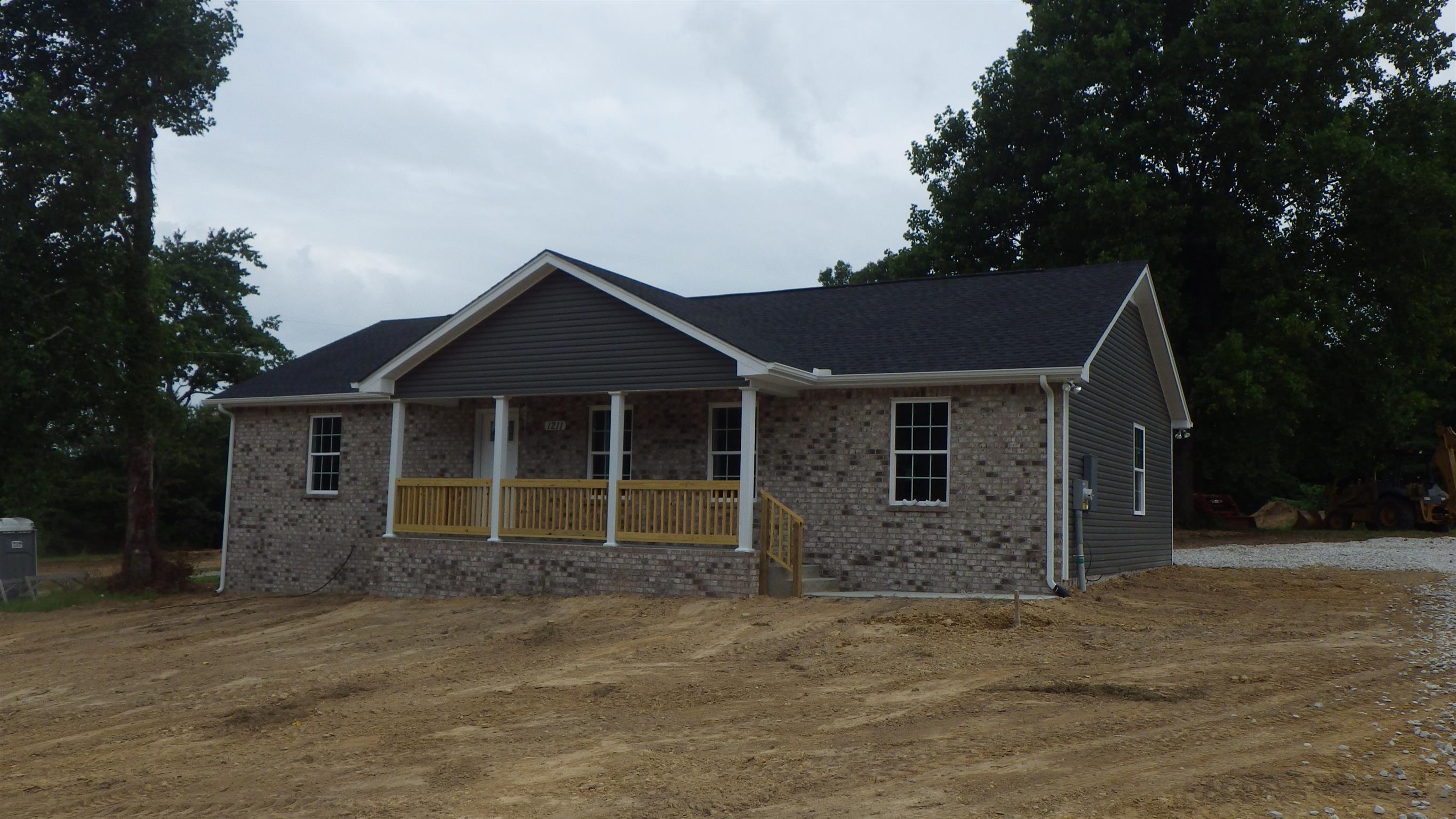 1211 East Ab Wade Road Portland, TN 37148 - Photo 1 of 30 front view of a house with a yard