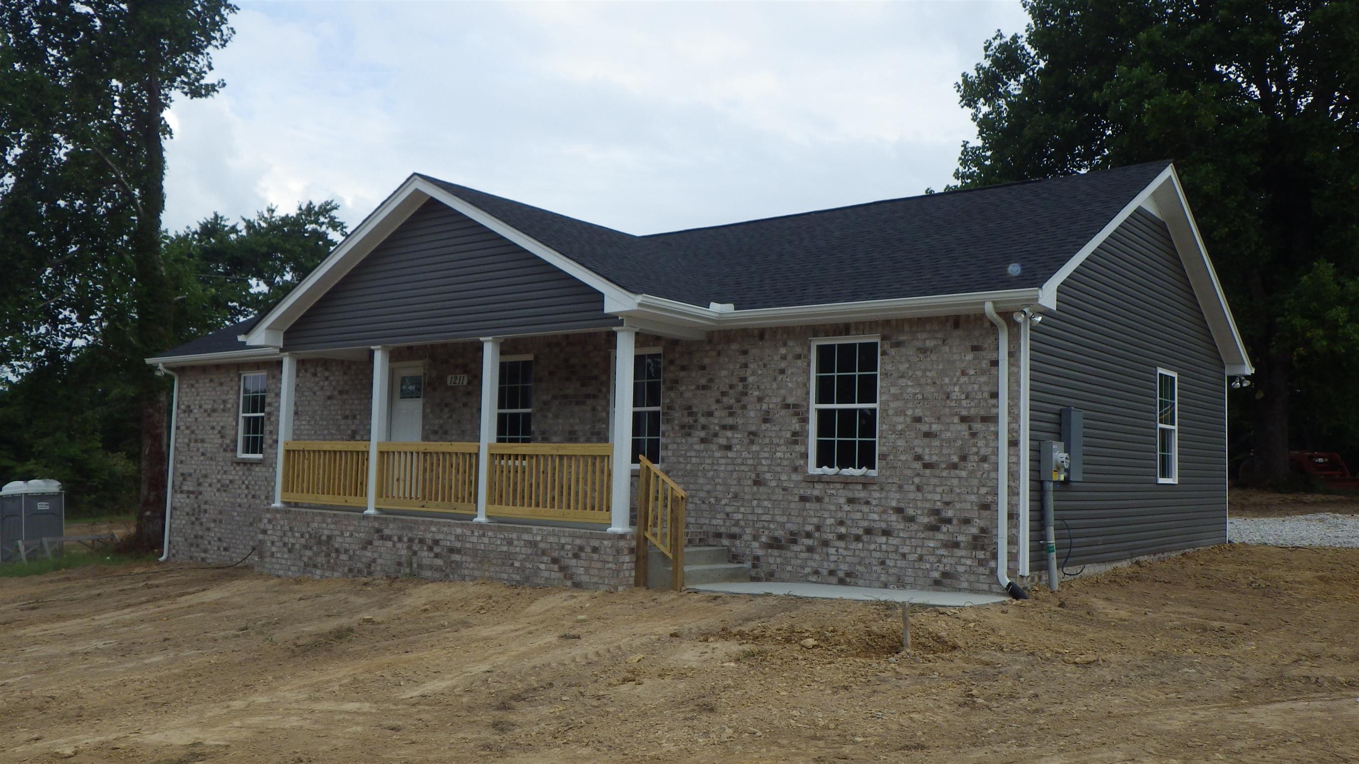 1211 East Ab Wade Road Portland, TN 37148 - Photo 2 of 30 a front view of a house with a yard
