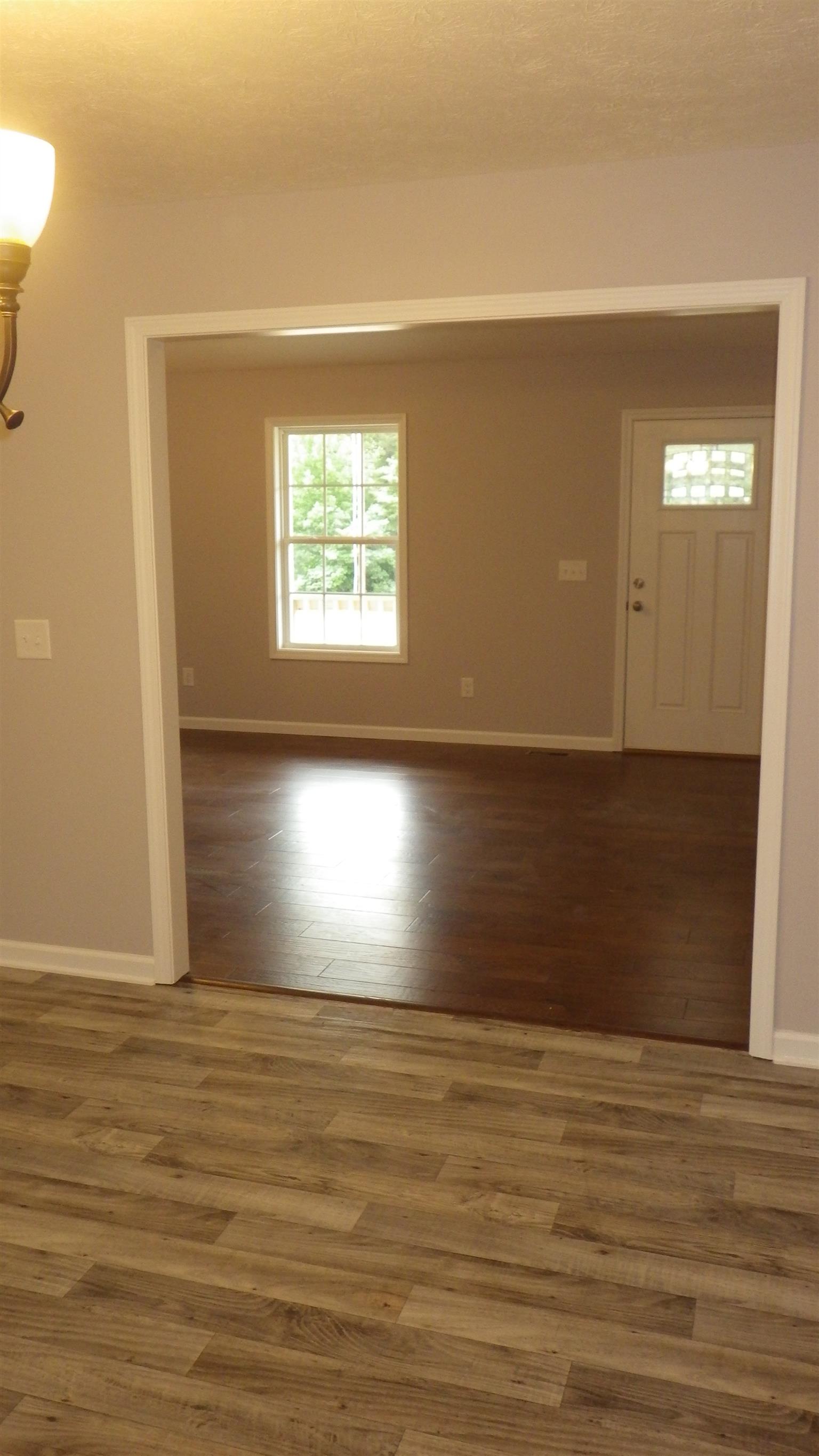 1211 East Ab Wade Road Portland, TN 37148 - Photo 25 of 30 a view of empty room with window and wooden floor