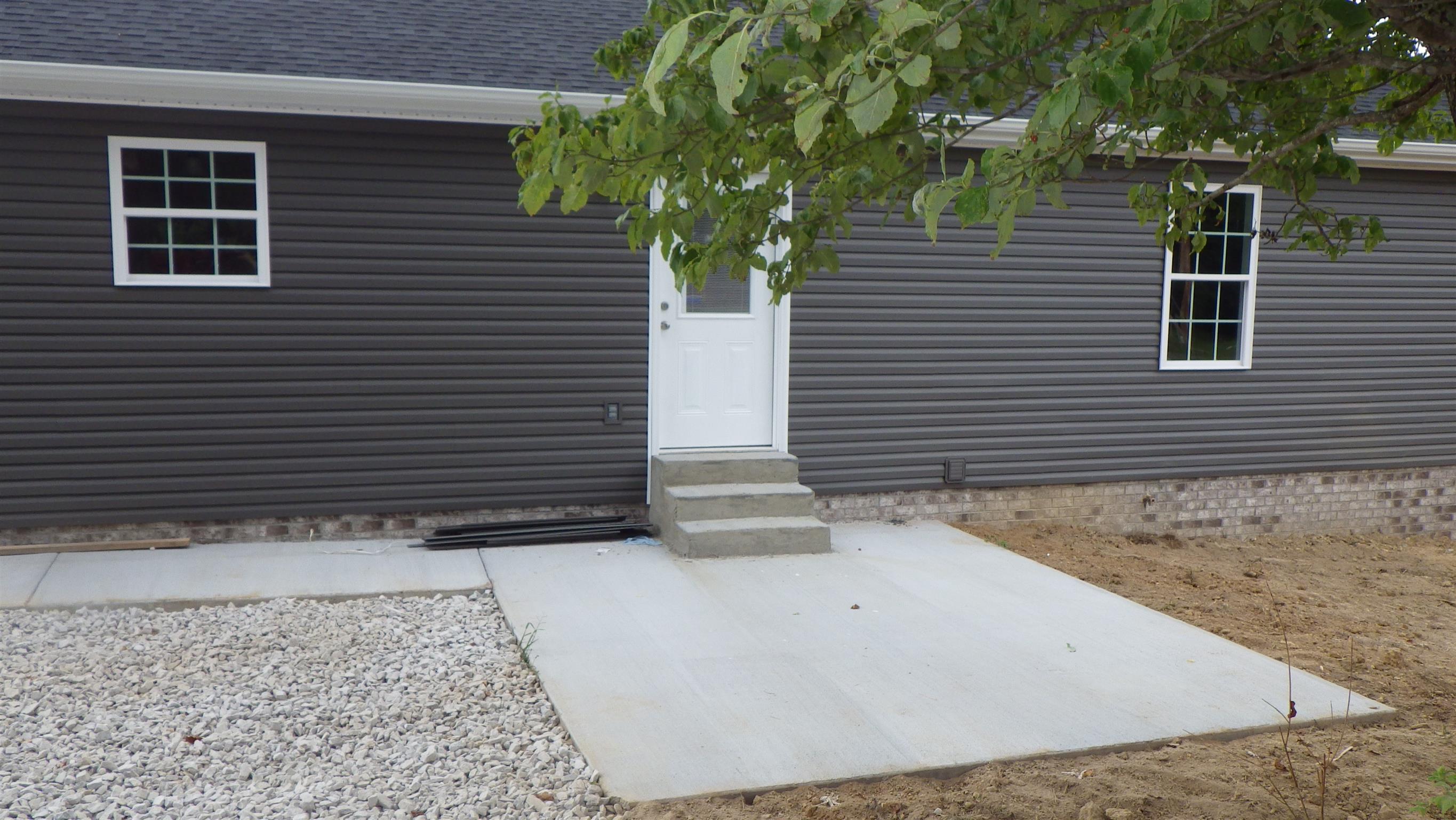 1211 East Ab Wade Road Portland, TN 37148 - Photo 28 of 30 a view of front door and potted plants