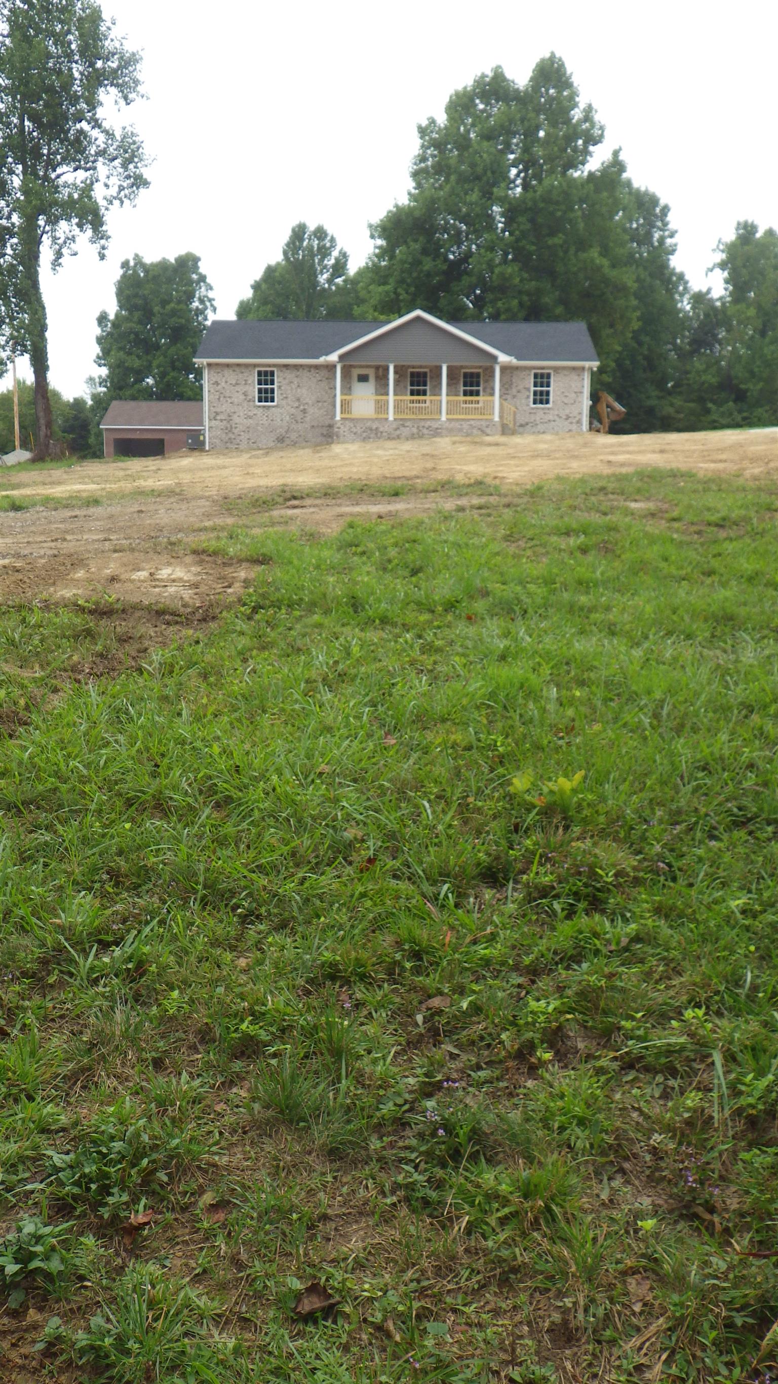 1211 East Ab Wade Road Portland, TN 37148 - Photo 29 of 30 a front view of a house with yard
