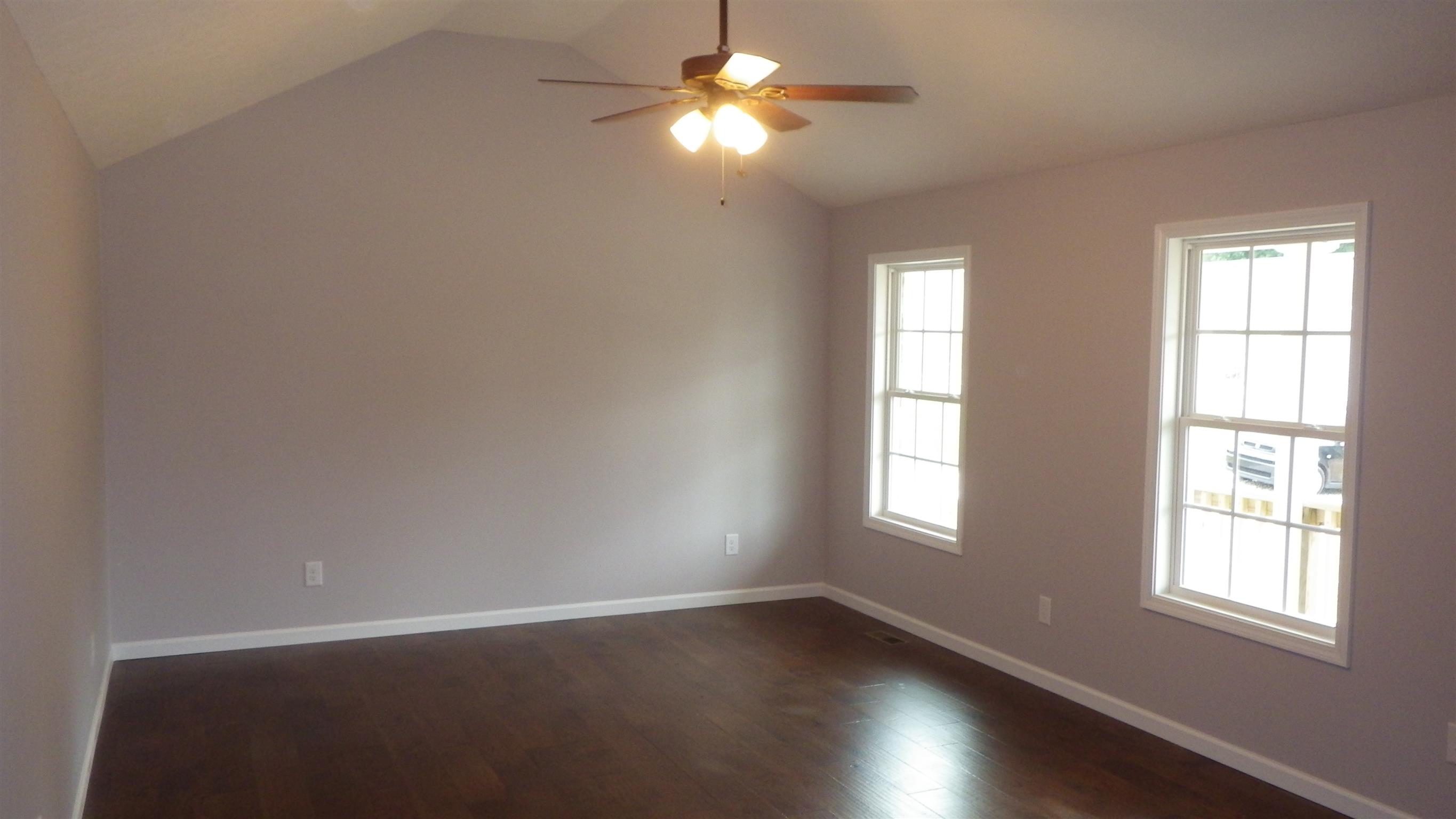 1211 East Ab Wade Road Portland, TN 37148 - Photo 6 of 30 wooden floor in an empty room with a window