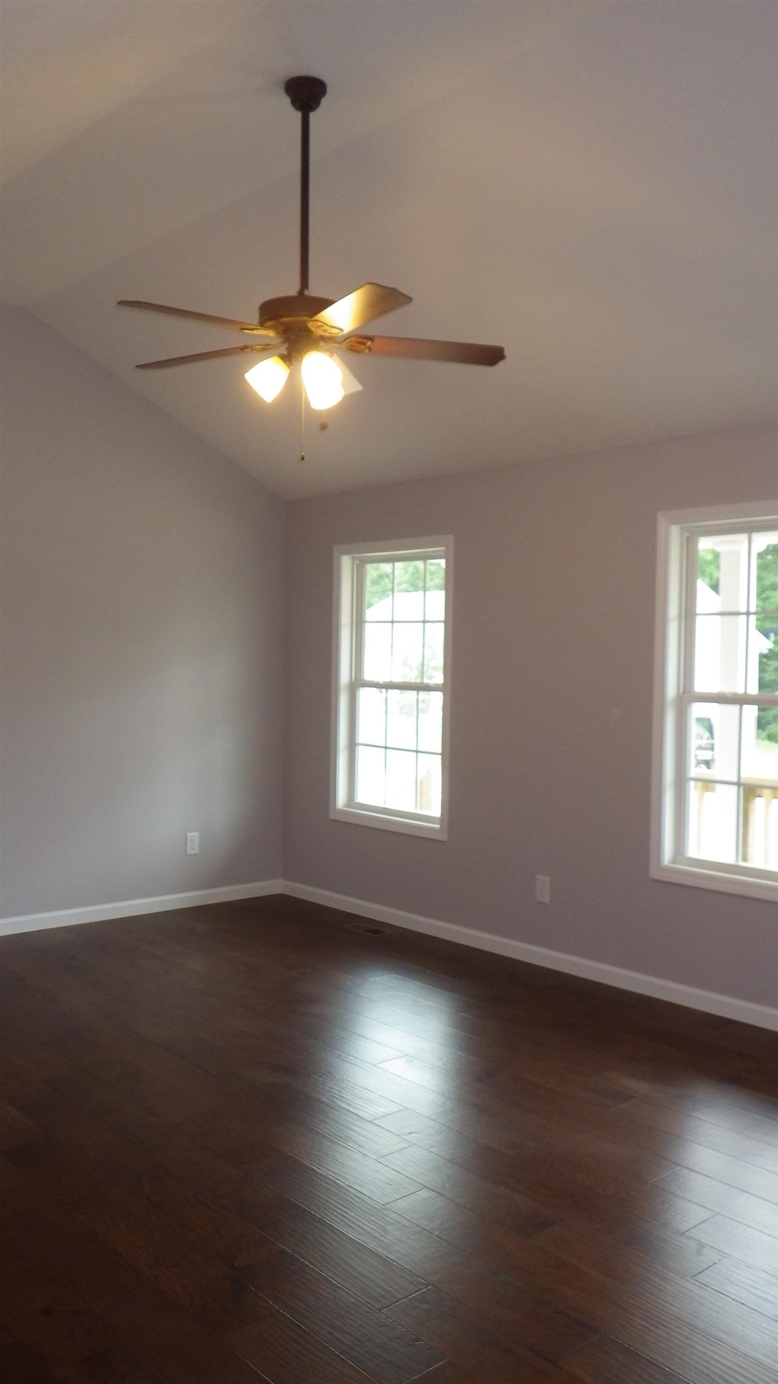 1211 East Ab Wade Road Portland, TN 37148 - Photo 7 of 30 wooden floor in an empty room with a window
